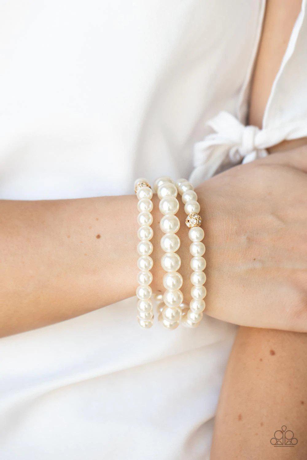 Here Comes The Heiress Gold Bracelet - Paparazzi Accessories- on model - CarasShop.com - Paparazzi Jewelry by Cara Jewels