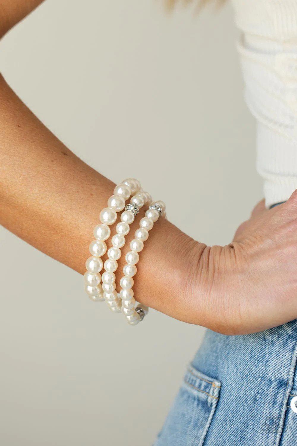 Here Comes The Heiress White Pearl & Rhinestone Bracelet - Paparazzi Accessories- on model - CarasShop.com - Paparazzi Jewelry by Cara Jewels