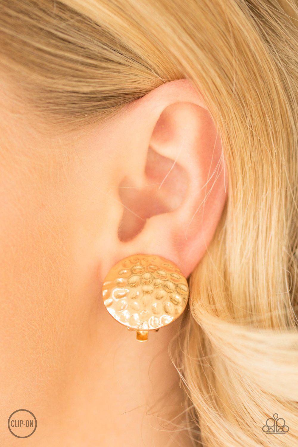 Hold The SHINE Hammered Gold Clip-on Earrings - Paparazzi Accessories- on model - CarasShop.com - Paparazzi Jewelry by Cara Jewels