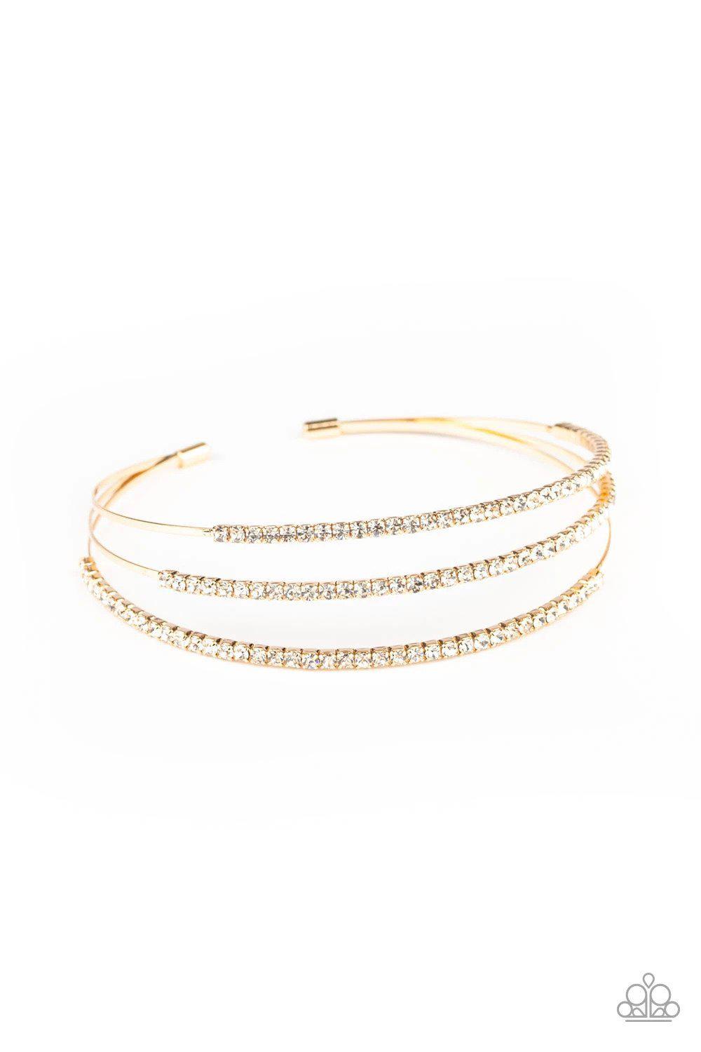 Iridescently Infatuated Gold and White Rhinestone Cuff Bracelet - Paparazzi Accessories- on model - CarasShop.com - Paparazzi Jewelry by Cara Jewels