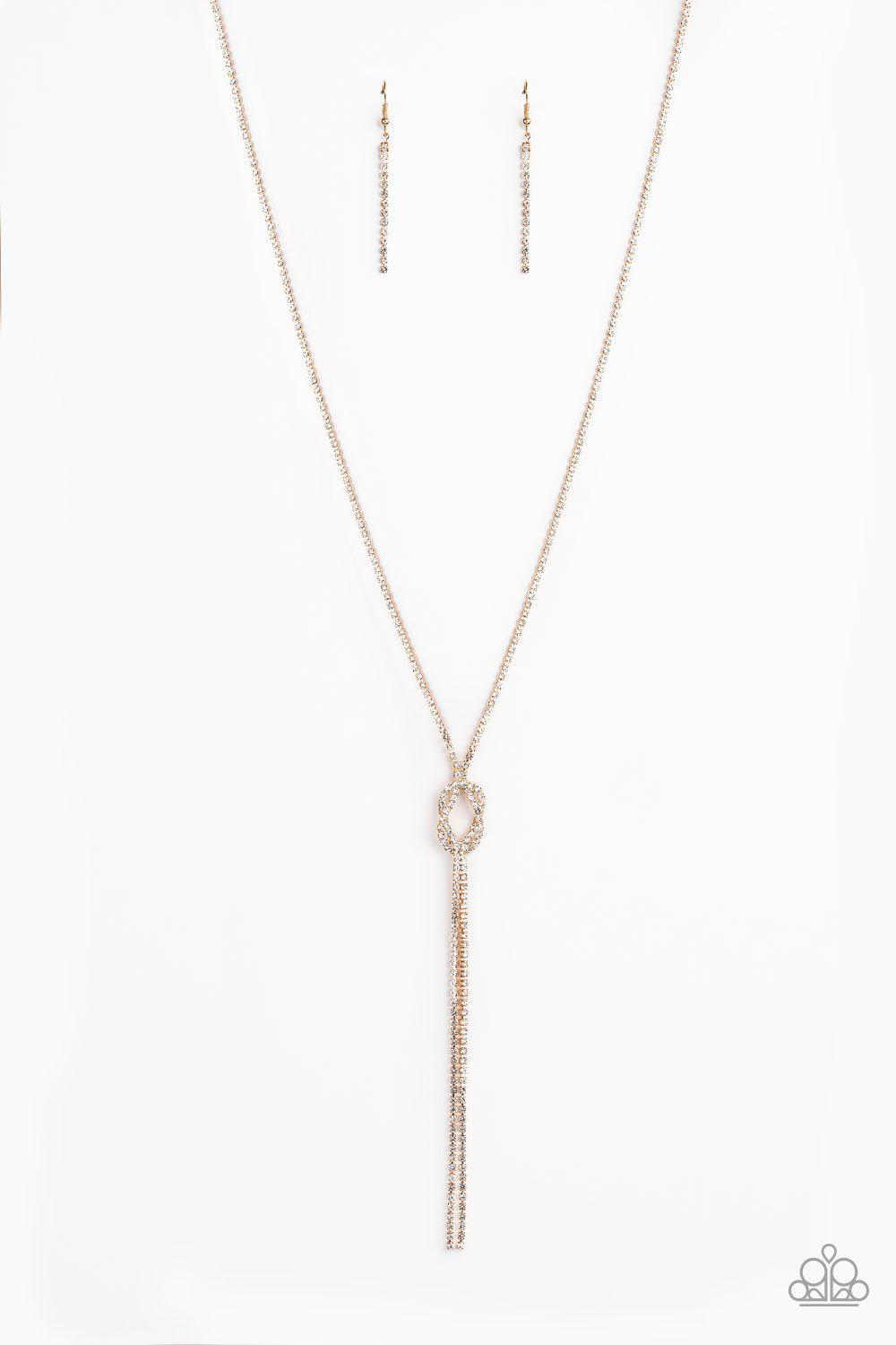 Knockout Knot Gold and White Rhinestone Necklace - Paparazzi Accessories - free matching earrings -CarasShop.com - Paparazzi Jewelry by Cara Jewels