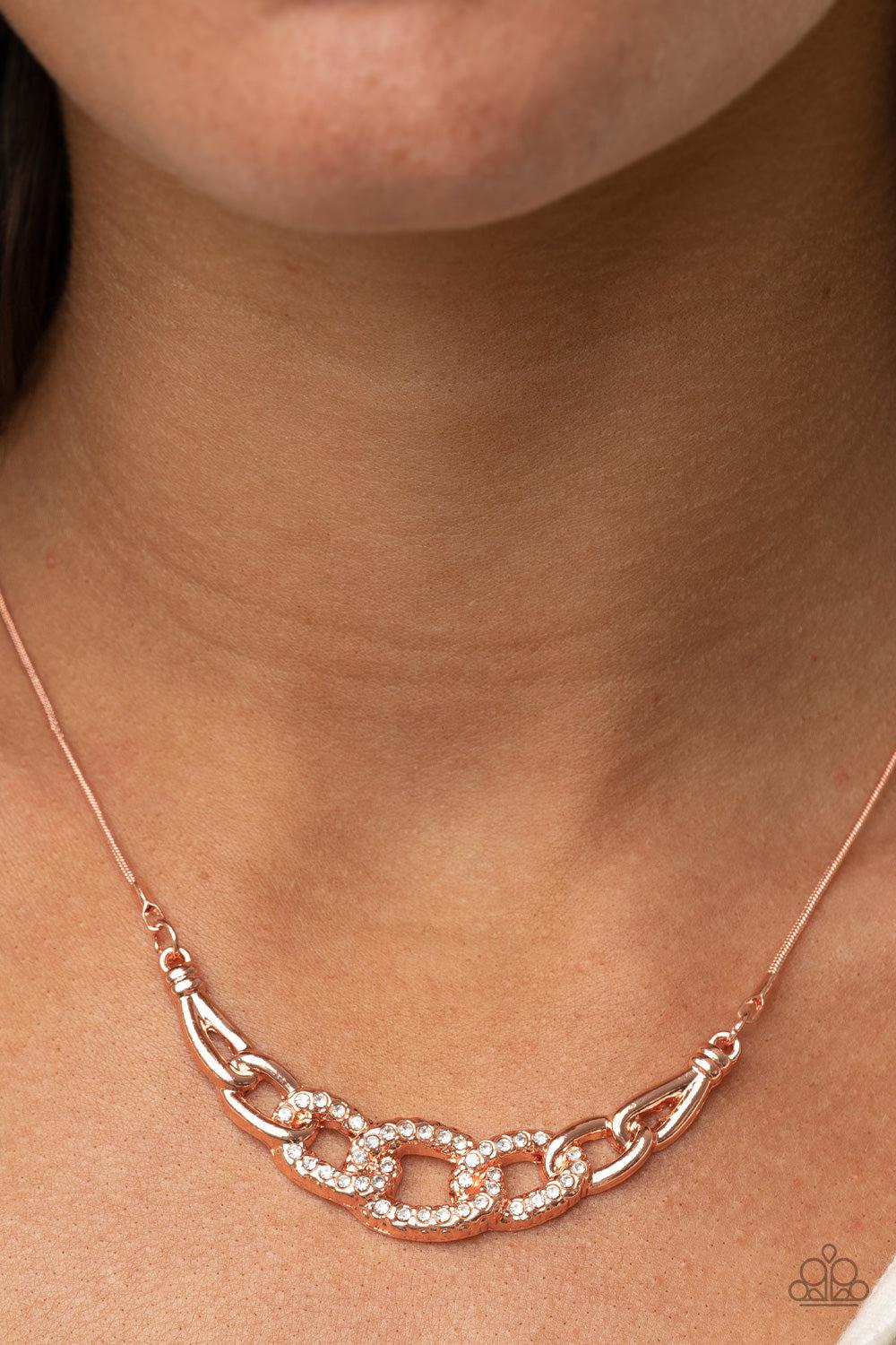 KNOT In Love Copper and Rhinestone Necklace - Paparazzi Accessories- on model - CarasShop.com - Paparazzi Jewelry by Cara Jewels