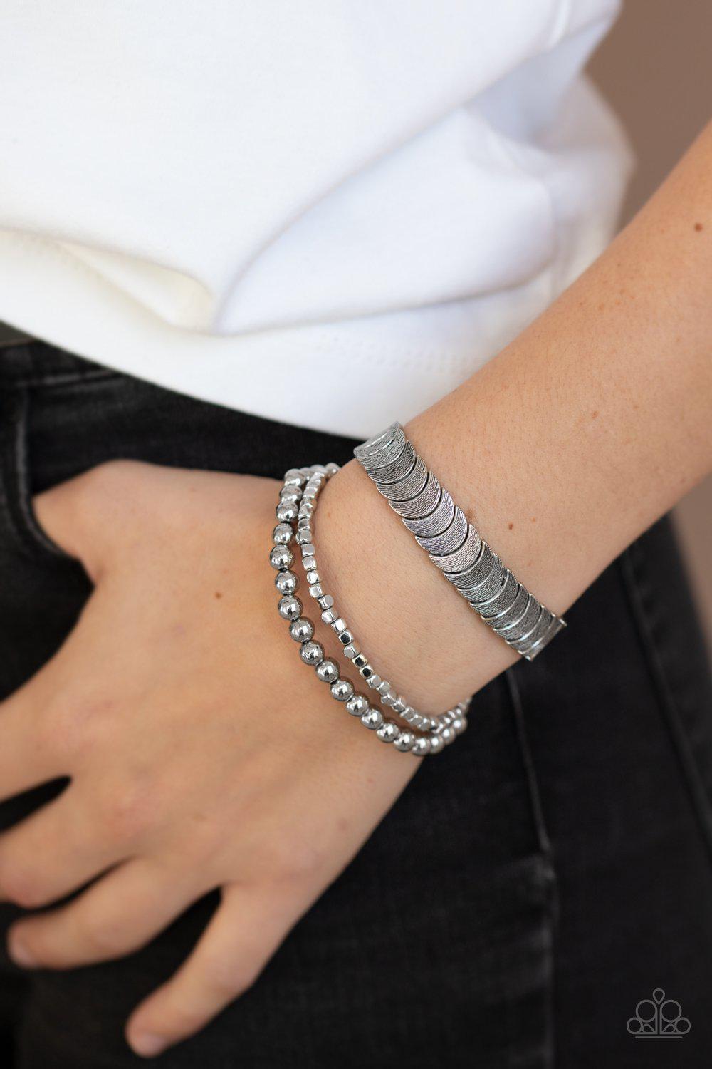 LAYER It On Me Silver Stretch Bracelet Set - Paparazzi Accessories- on model - CarasShop.com - Paparazzi Jewelry by Cara Jewels