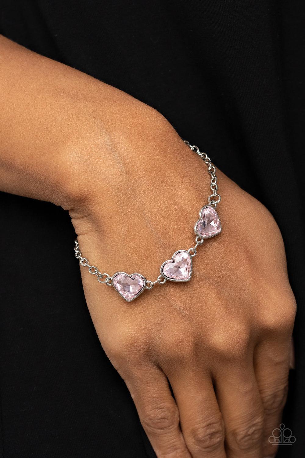Little Heartbreaker Pink Heart Bracelet - Paparazzi Accessories- on model - CarasShop.com - Paparazzi Jewelry by Cara Jewels