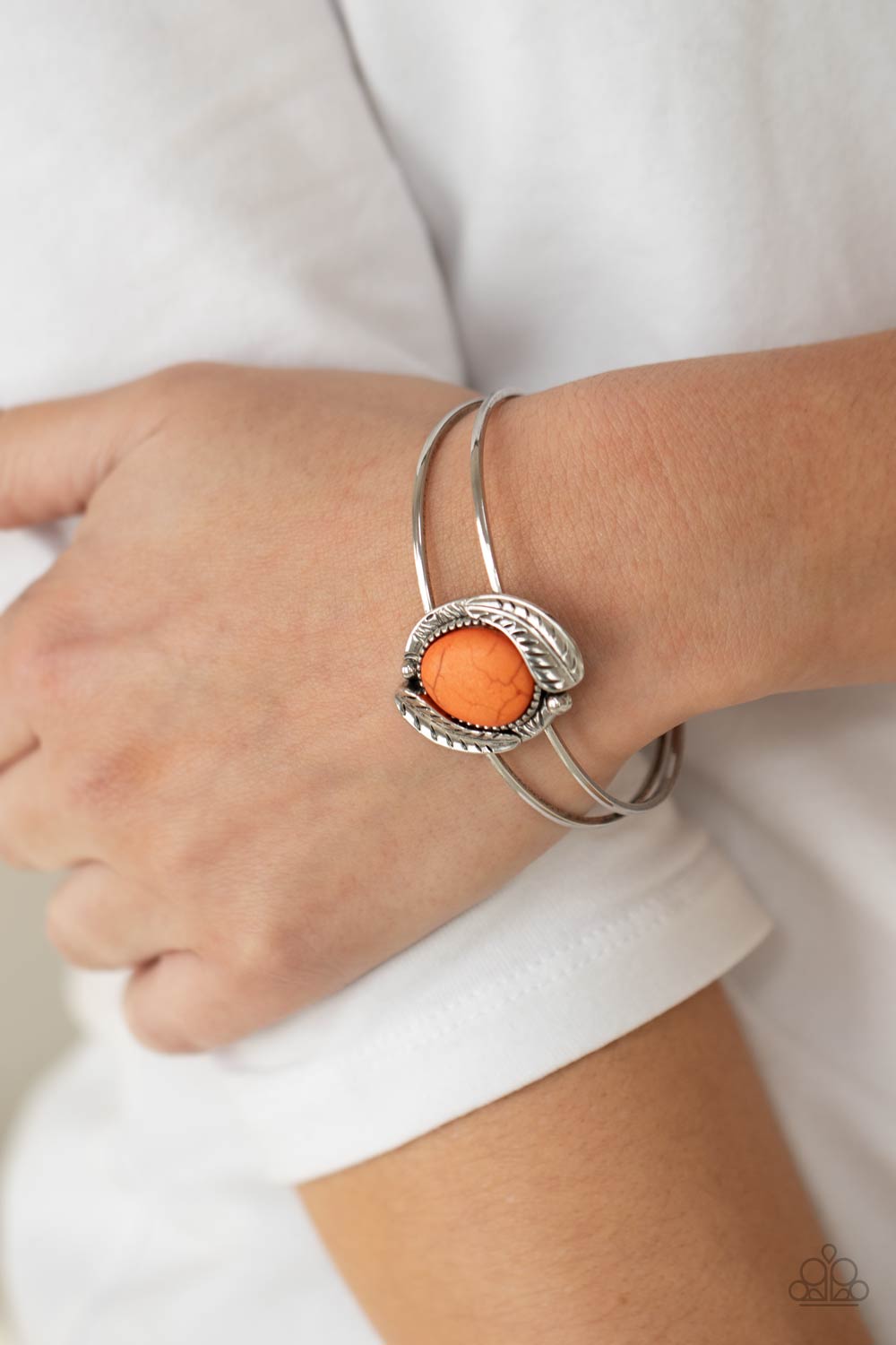 Living Off The BANDLANDS Orange Stone Cuff Bracelet - Paparazzi Accessories- on model - CarasShop.com - Paparazzi Jewelry by Cara Jewels