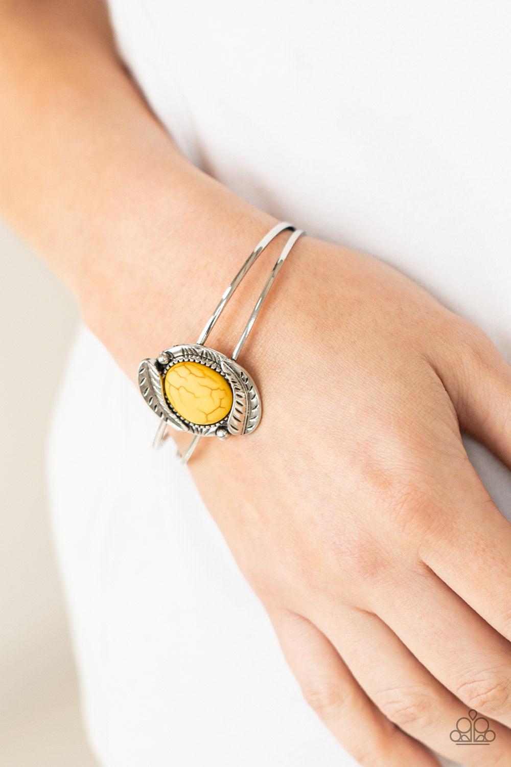 Living Off The BANDLANDS Yellow Stone Cuff Bracelet - Paparazzi Accessories- on model - CarasShop.com - Paparazzi Jewelry by Cara Jewels