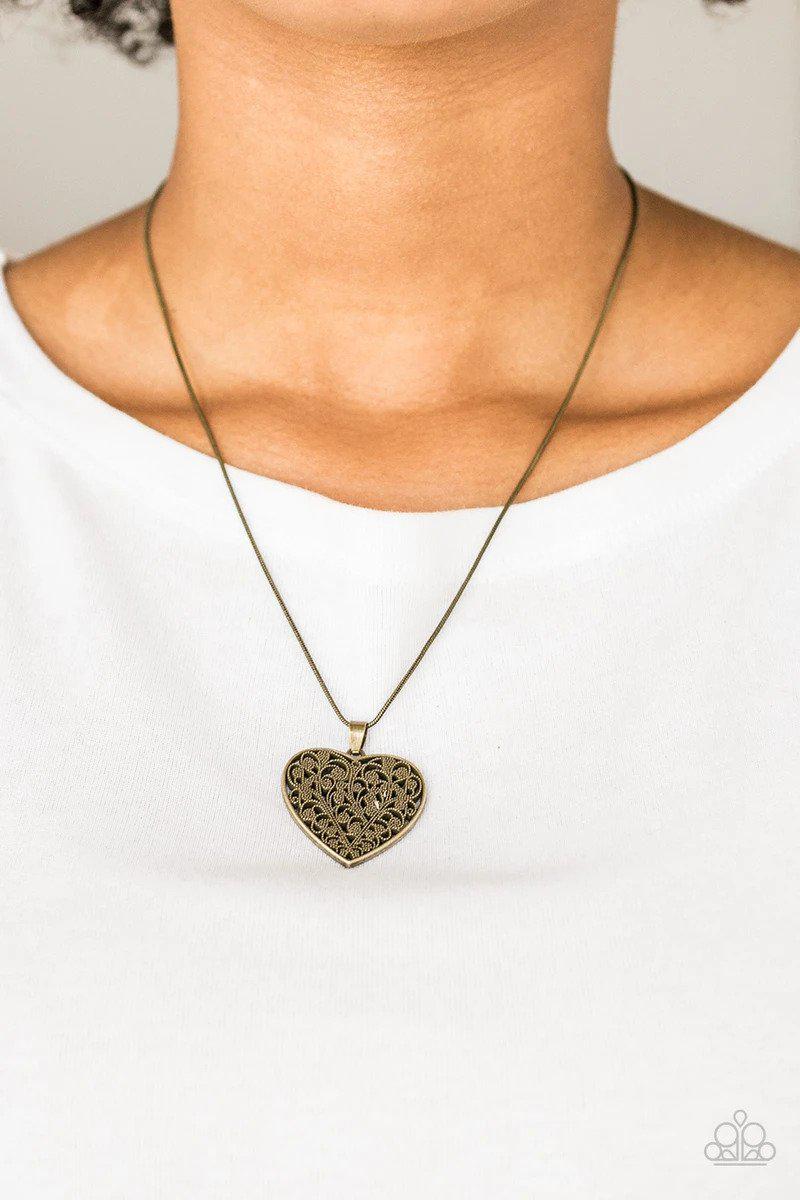 Look Into Your Heart Brass Filigree Heart Necklace - Paparazzi Accessories- on model - CarasShop.com - Paparazzi Jewelry by Cara Jewels