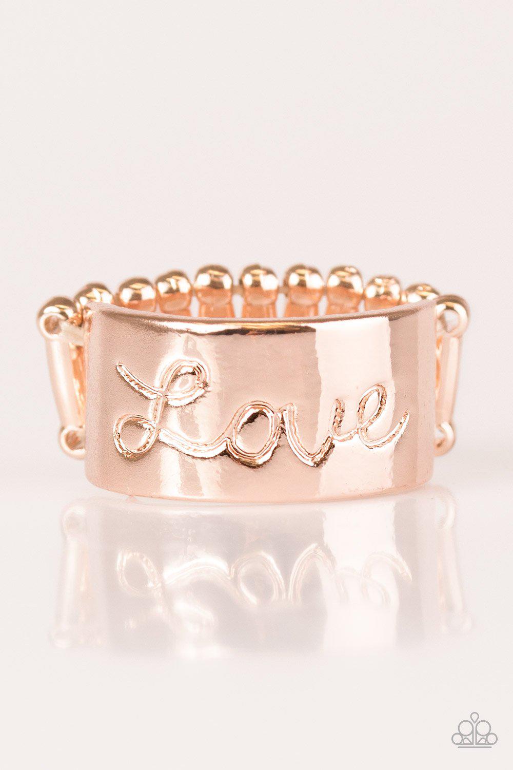 Love Hard Rose Gold Ring - Paparazzi Accessories- on model - CarasShop.com - Paparazzi Jewelry by Cara Jewels