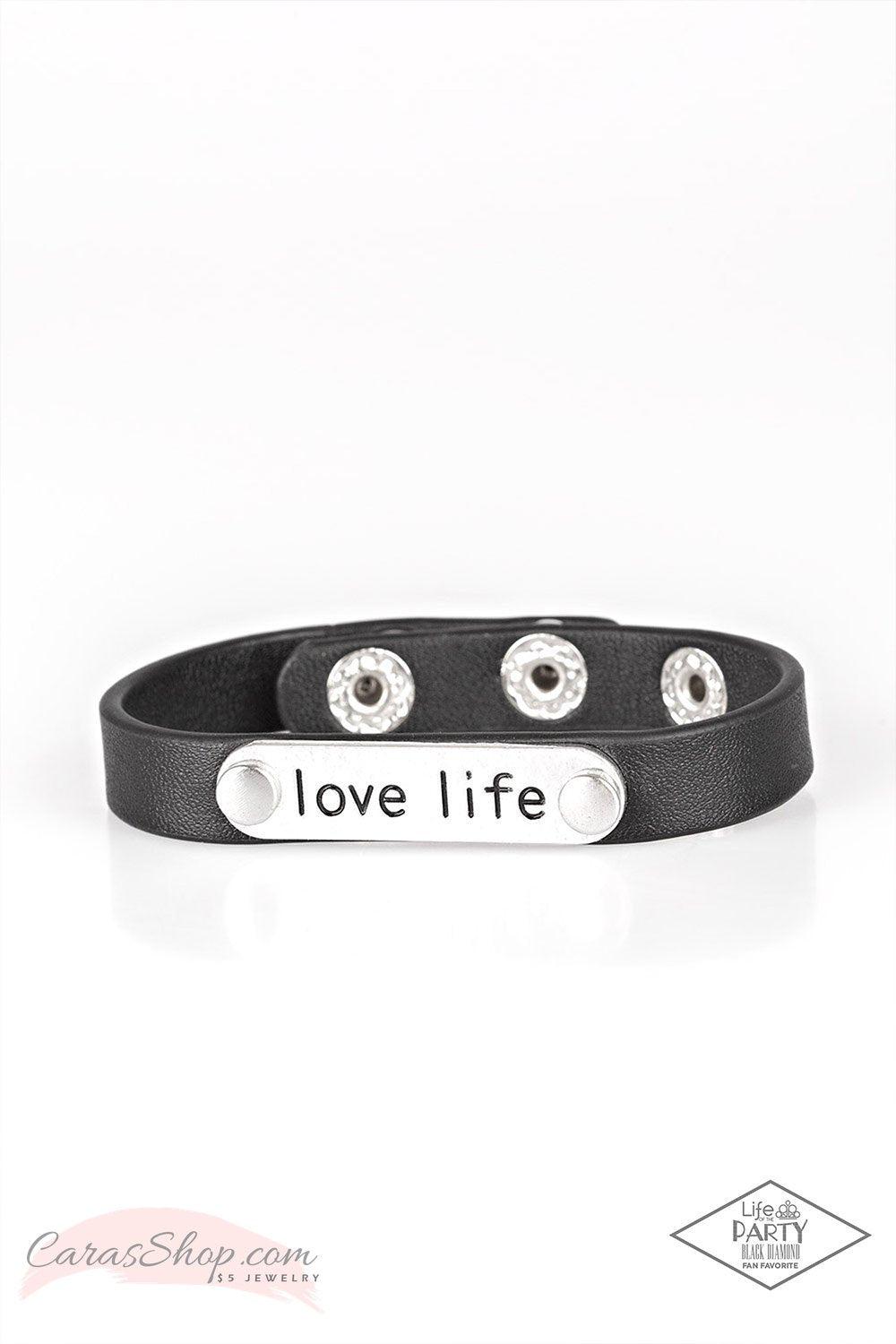 Love-Life Black Leather Wrap Snap Word Bracelet - Paparazzi Accessories- on model - CarasShop.com - Paparazzi Jewelry by Cara Jewels
