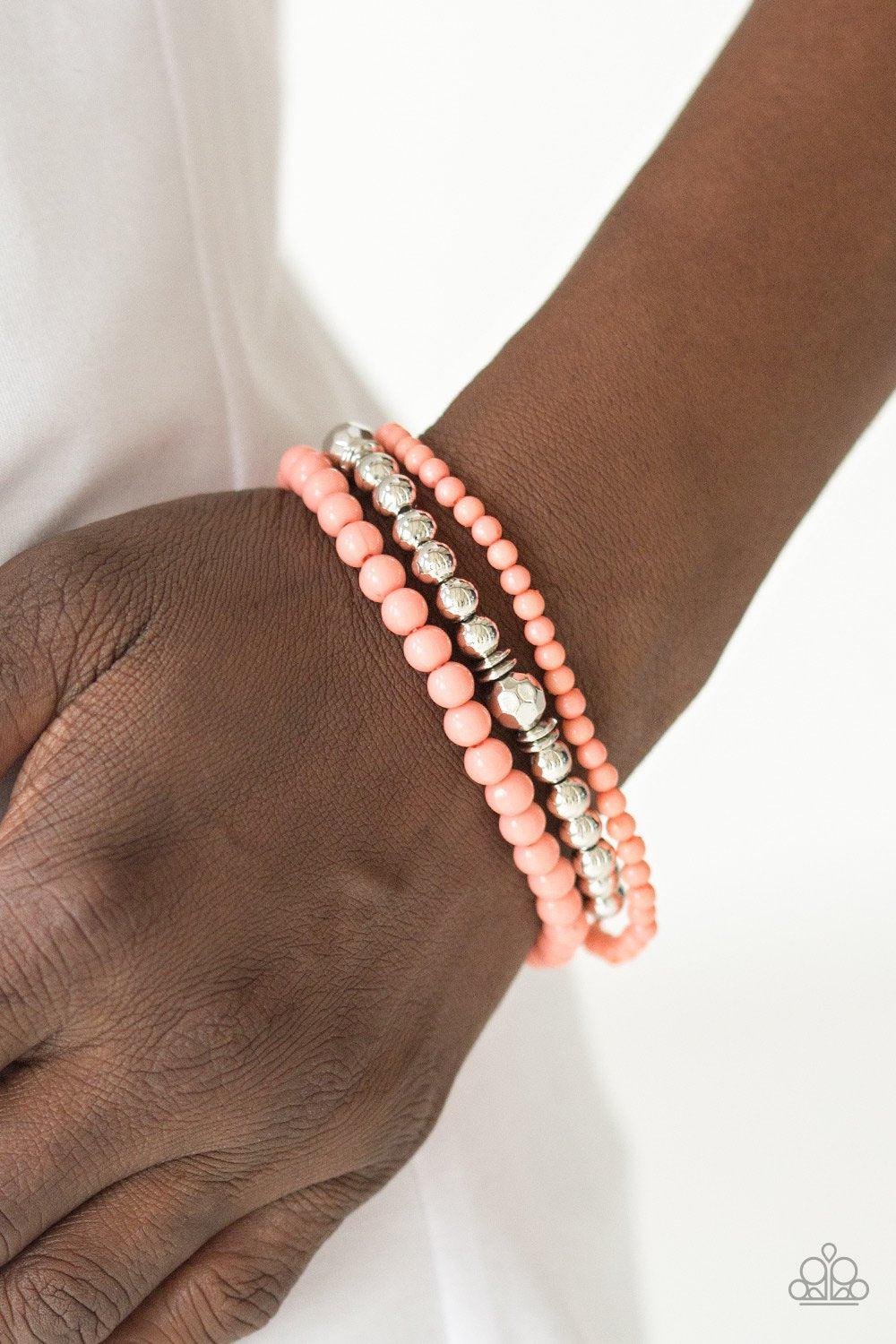 Midsummer Marvel Coral and Silver Bracelet Set - Paparazzi Accessories- on model - CarasShop.com - Paparazzi Jewelry by Cara Jewels