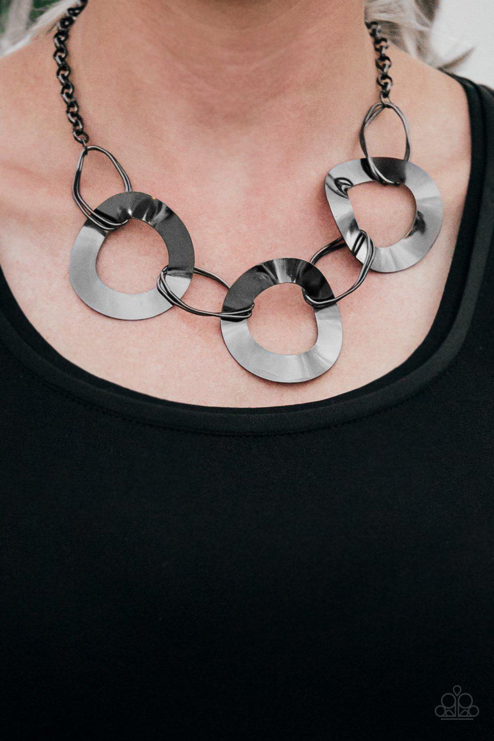Modern Mechanics Gunmetal Black Necklace - Paparazzi Accessories- on model - CarasShop.com - Paparazzi Jewelry by Cara Jewels