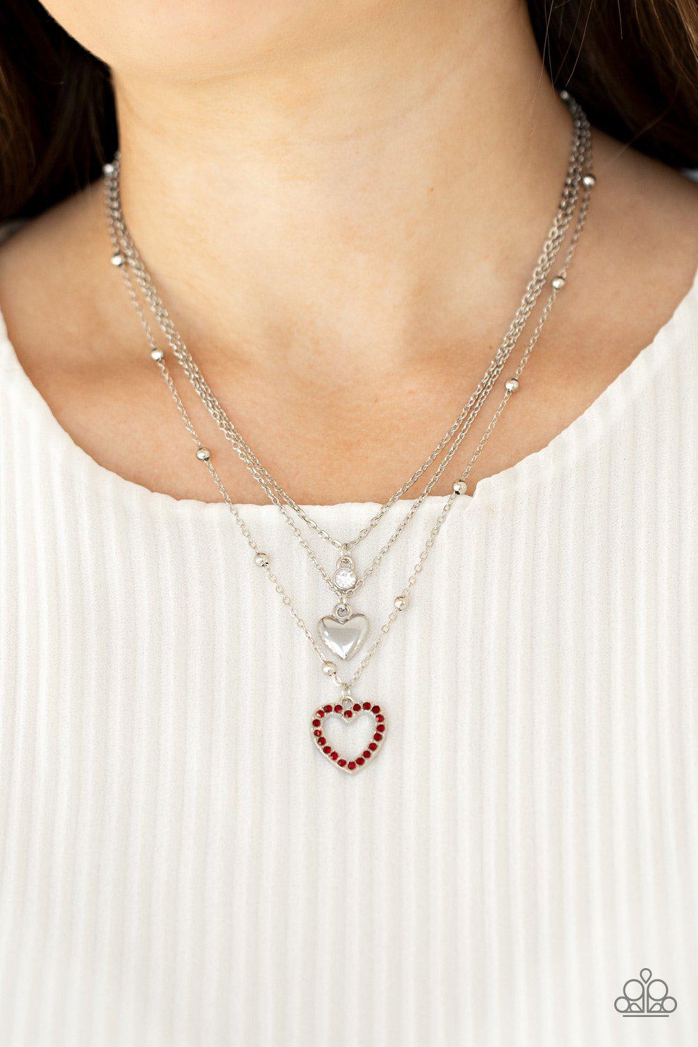 Never Miss a Beat Red Rhinestone and Silver Heart Necklace - Paparazzi Accessories- on model - CarasShop.com - Paparazzi Jewelry by Cara Jewels