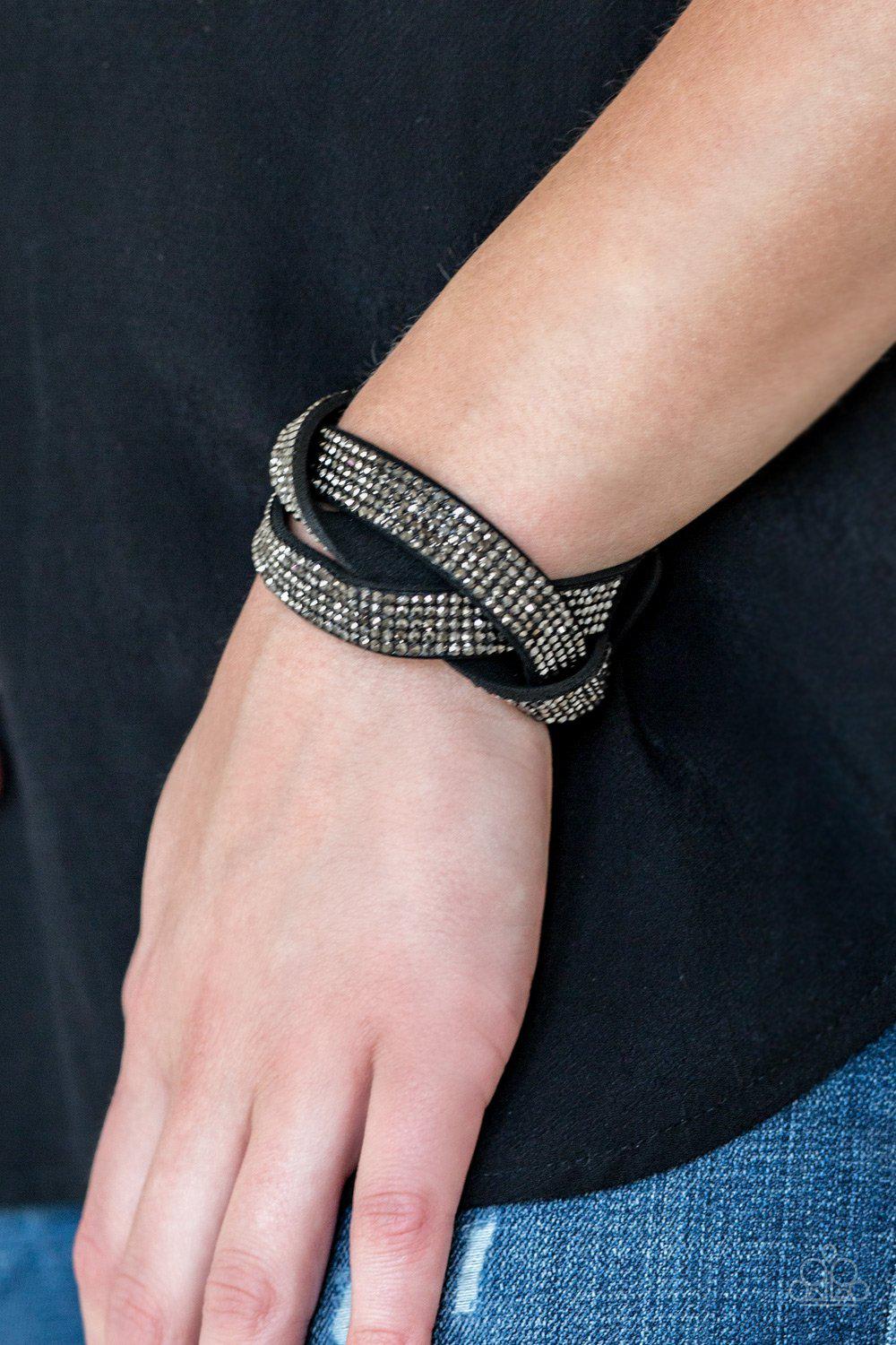 Nice Girls Finish Last Black Hematite Braided Wrap Snap Bracelet - Paparazzi Accessories- on model - CarasShop.com - Paparazzi Jewelry by Cara Jewels