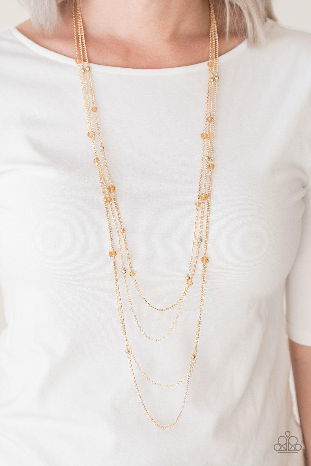 On The Front Shine Long Gold Necklace - Paparazzi Accessories- lightbox - CarasShop.com - Paparazzi Jewelry by Cara Jewels