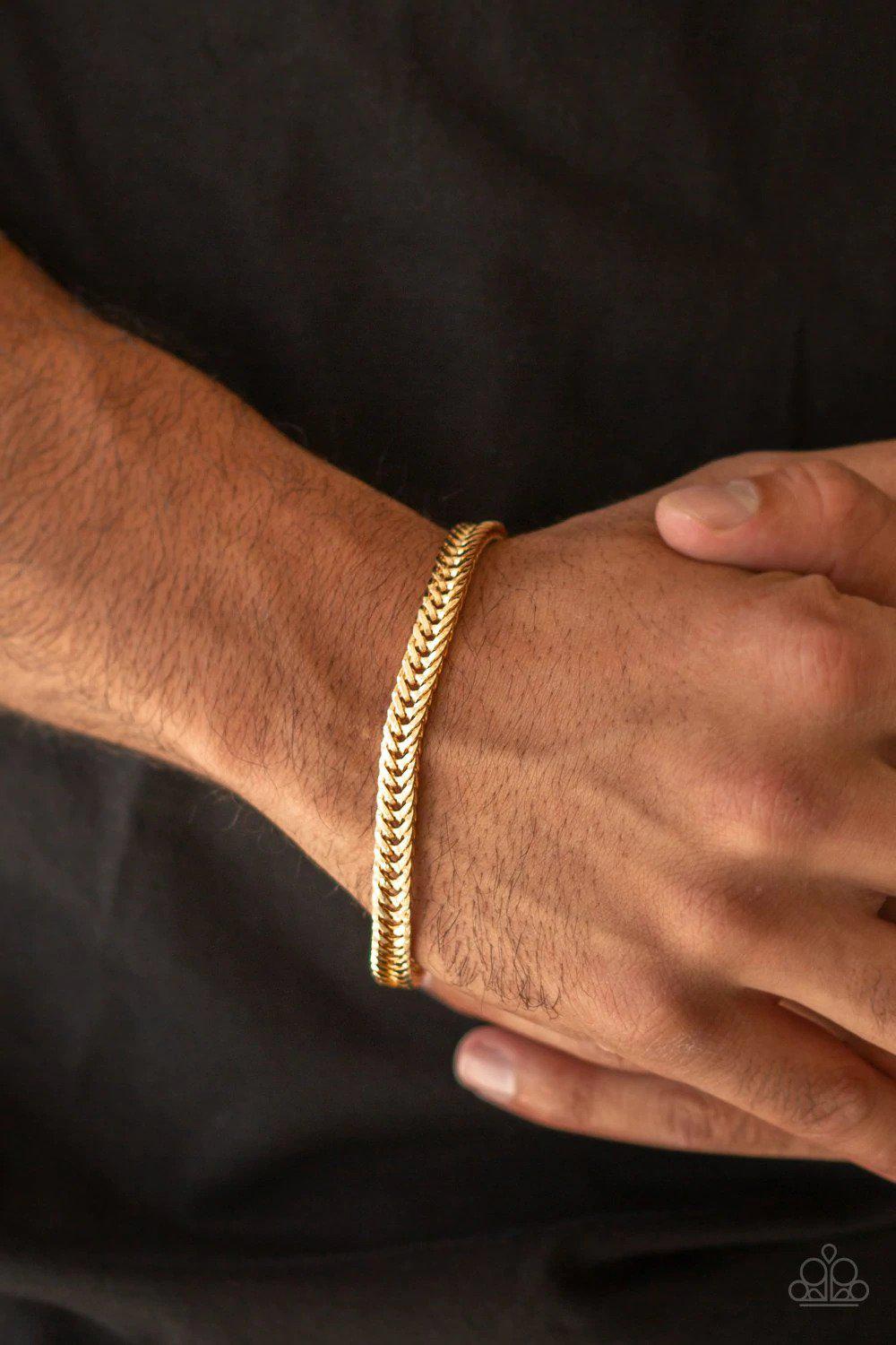 One-Two Knockout Gold Bracelet - Paparazzi Accessories- on model - CarasShop.com - Paparazzi Jewelry by Cara Jewels