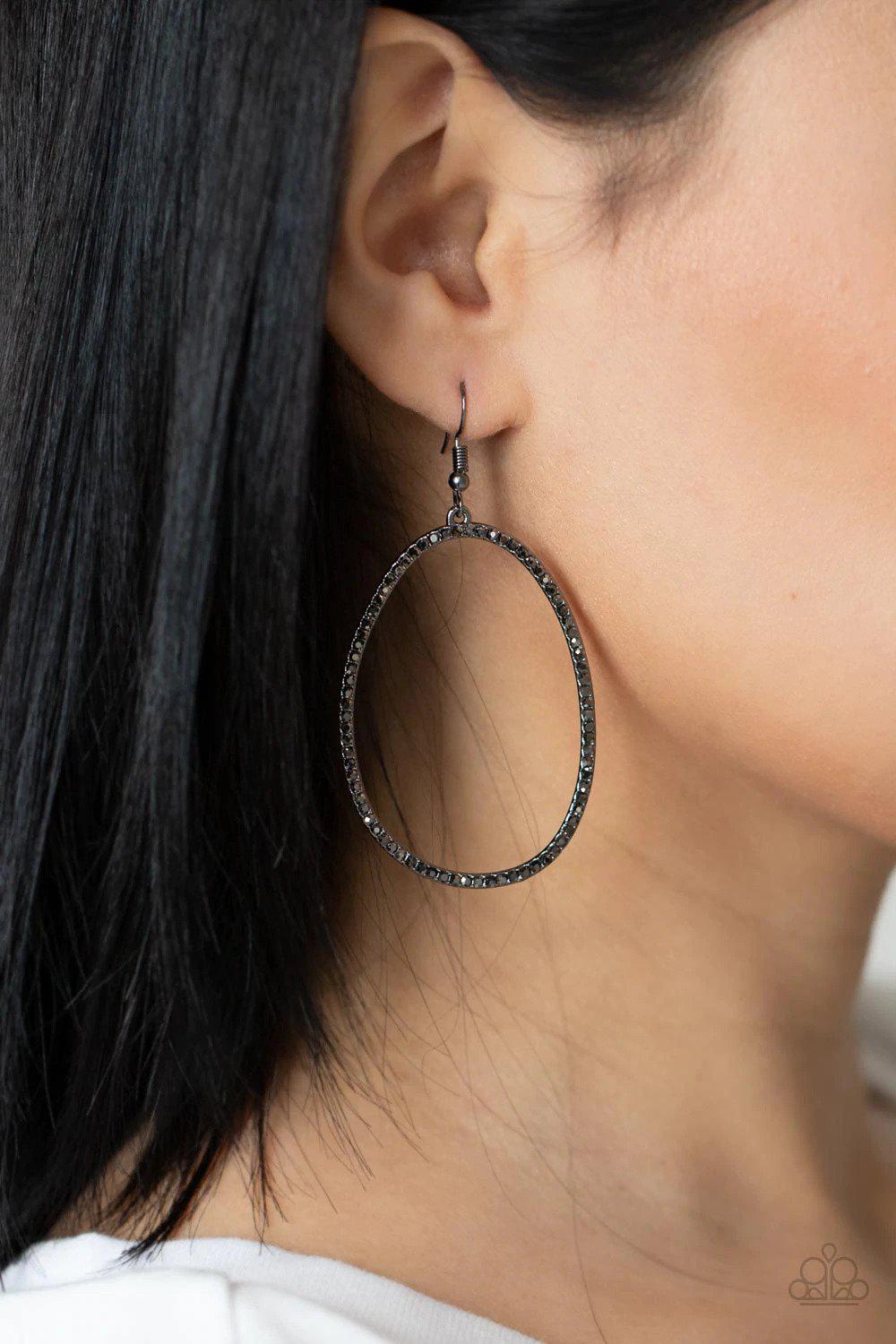 OVAL-ruled! Gunmetal Black Earrings - Paparazzi Accessories- on model - CarasShop.com - Paparazzi Jewelry by Cara Jewels