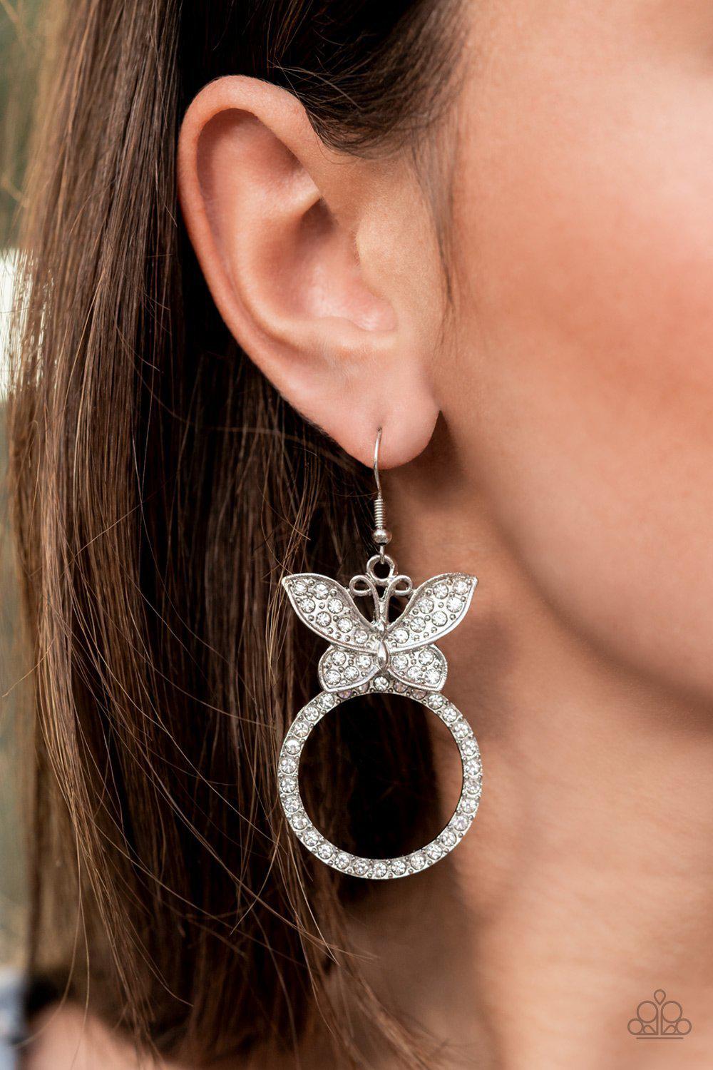 Paradise Found White Rhinestone Butterfly Earrings - Paparazzi Accessories- on model - CarasShop.com - Paparazzi Jewelry by Cara Jewels