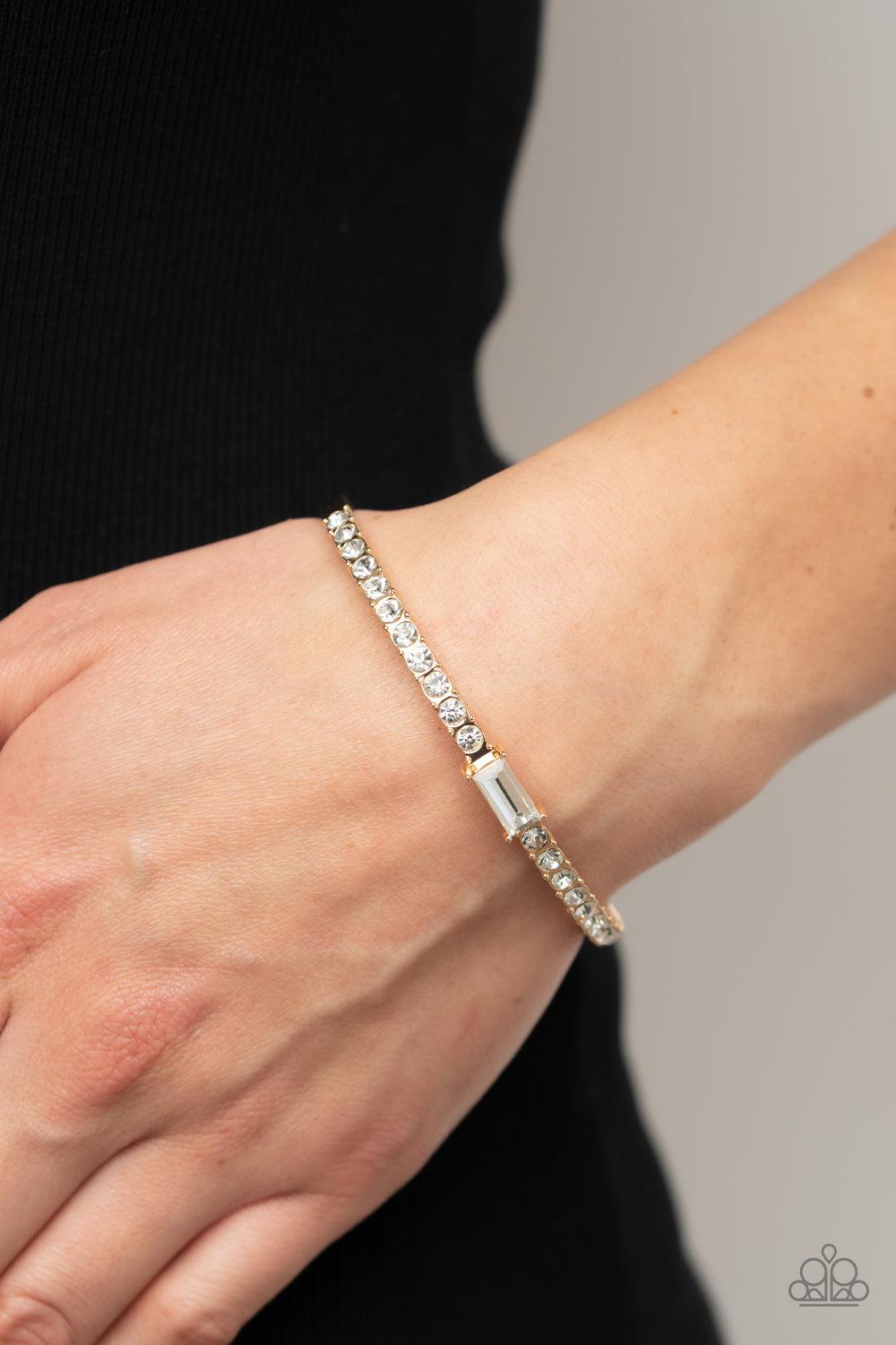 Party Crashing Couture Gold & White Rhinestone Bangle Bracelet - Paparazzi Accessories- on model - CarasShop.com - Paparazzi Jewelry by Cara Jewels