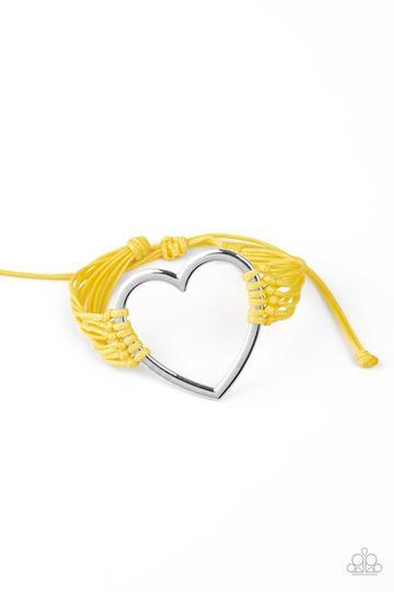 Playing With My HEARTSTRINGS Yellow and Silver Heart Charm Urban Knot Bracelet - Paparazzi Accessories- on model - CarasShop.com - Paparazzi Jewelry by Cara Jewels