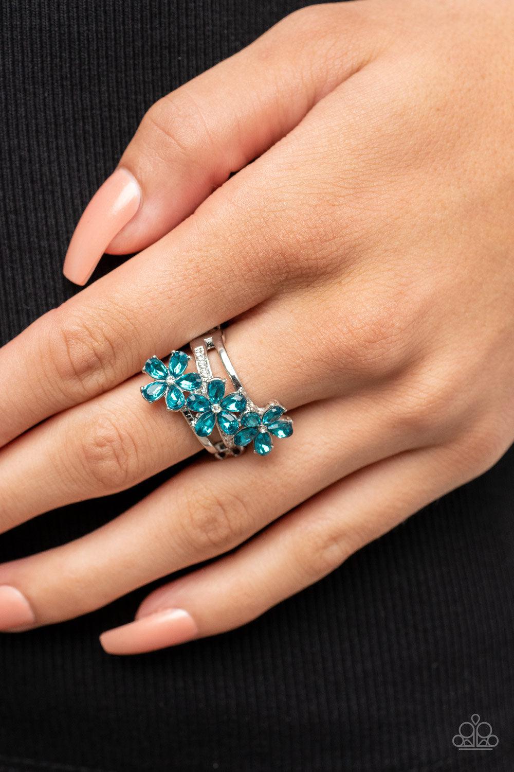 Posh Petals Blue Rhinestone Flower Ring - Paparazzi Accessories- on model - CarasShop.com - Paparazzi Jewelry by Cara Jewels
