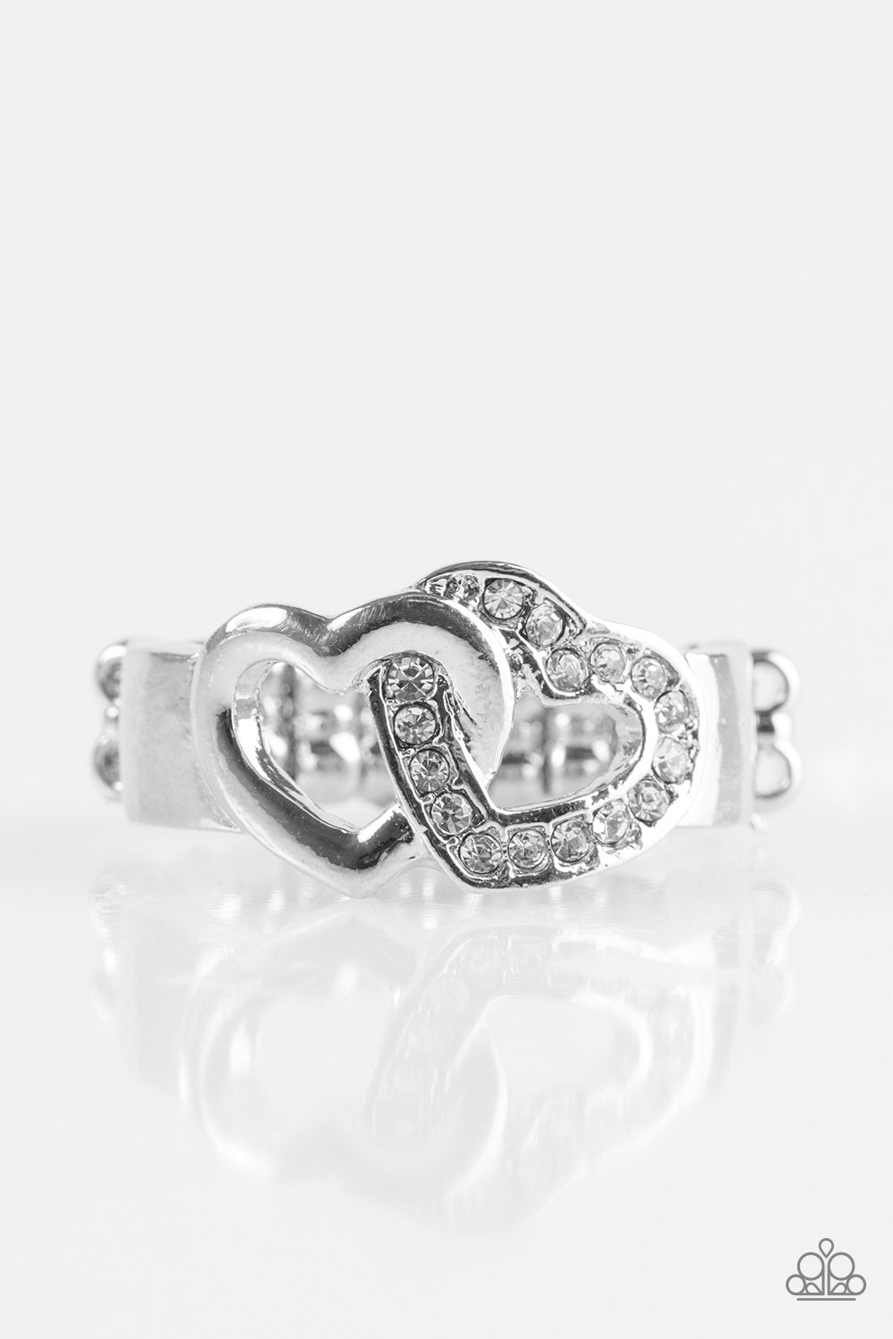 Pour Your Heart Out Silver and White Rhinestone Heart Ring - Paparazzi Accessories- on model - CarasShop.com - Paparazzi Jewelry by Cara Jewels