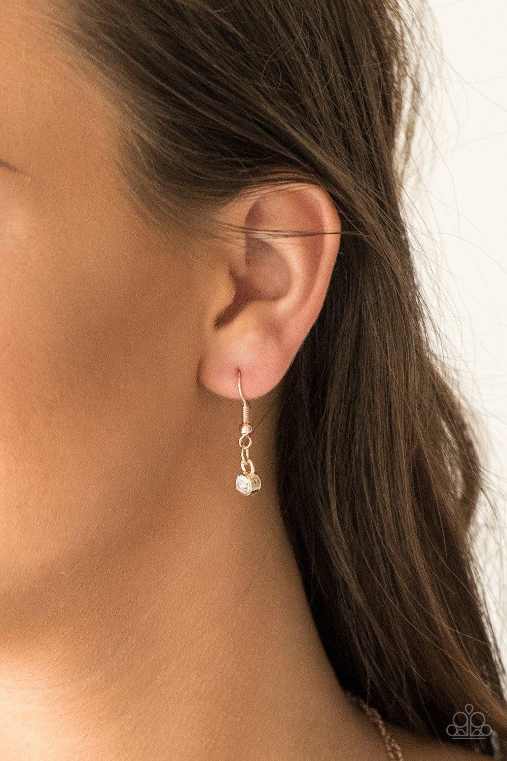 Pretty Petite Rose Gold and White Rhinestone Necklace - Paparazzi Accessories- on model - CarasShop.com - Paparazzi Jewelry by Cara Jewels