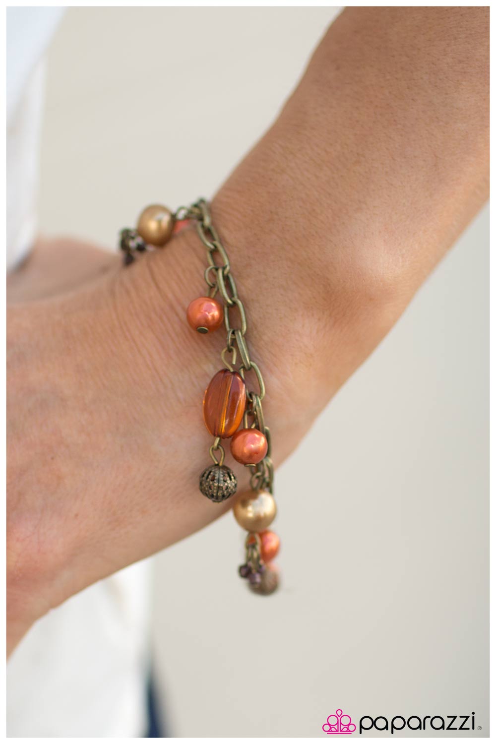 Pretty Please Orange & Brass Bracelet - Paparazzi Accessories- on model - CarasShop.com - Paparazzi Jewelry by Cara Jewels
