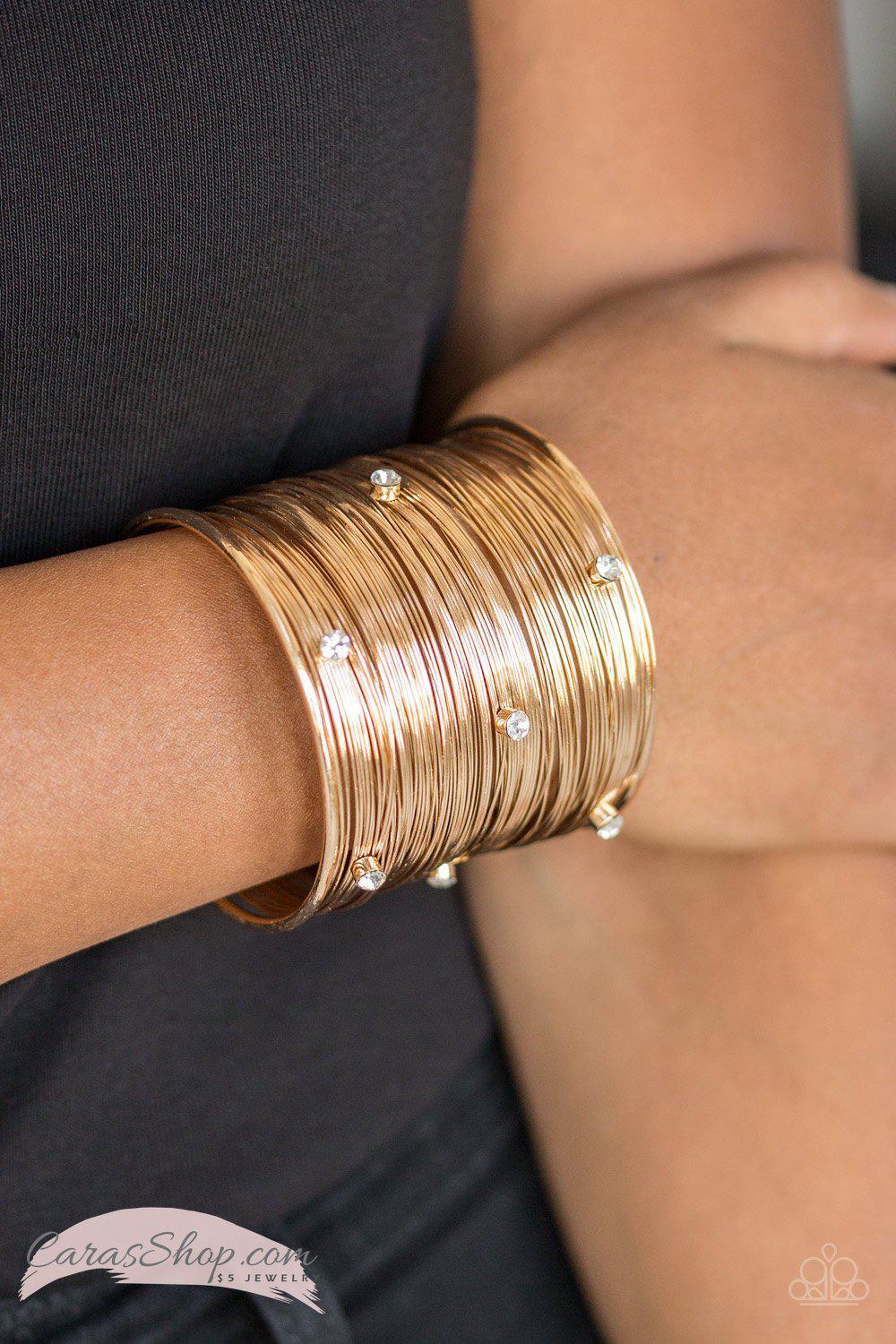 Professional Prima Donna - Gold Cuff Bracelet - Paparazzi Accessories- on model - CarasShop.com - Paparazzi Jewelry by Cara Jewels