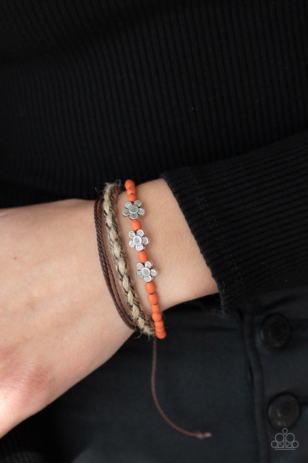 Raffia Remix Orange Wood and Silver Flower Urban Sliding Knot Bracelet - Paparazzi Accessories- on model - CarasShop.com - Paparazzi Jewelry by Cara Jewels