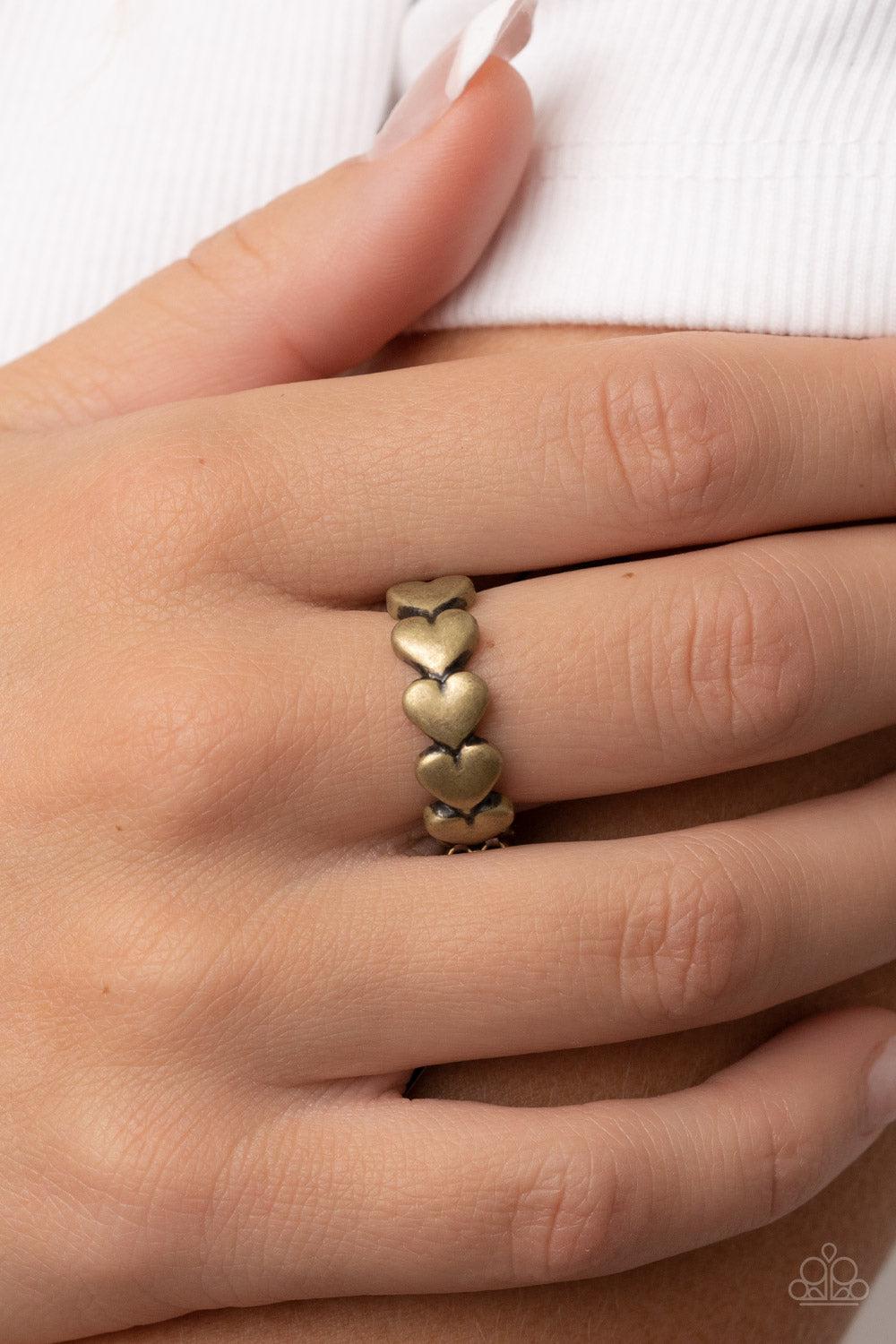 Rhythm of Love Brass Heart Ring - Paparazzi Accessories- on model - CarasShop.com - Paparazzi Jewelry by Cara Jewels