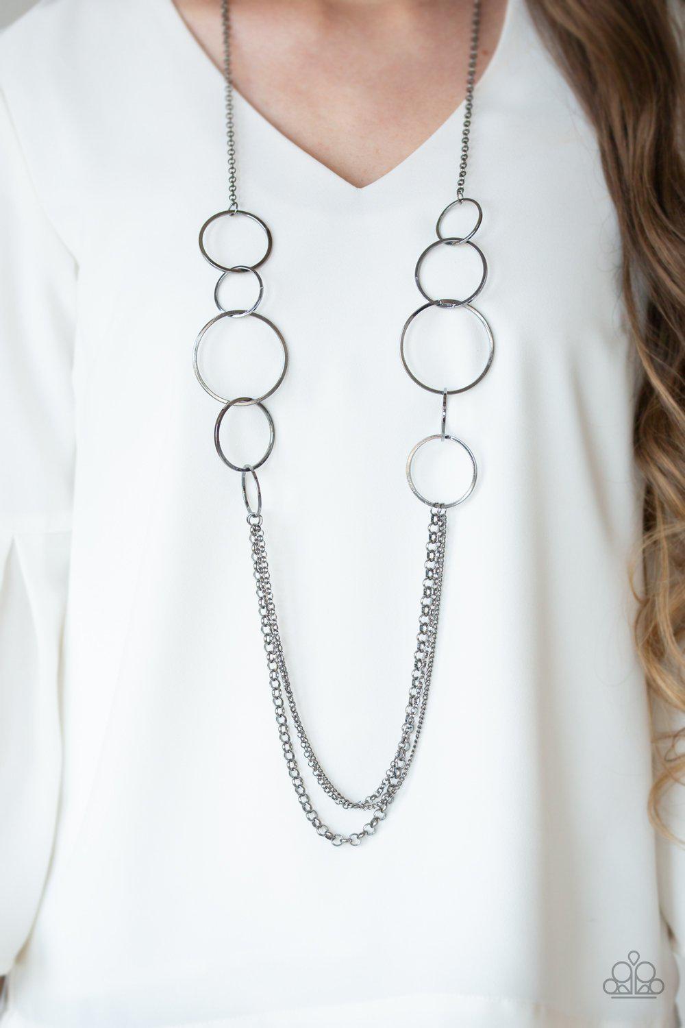 Ring In The Radiance Black Gunmetal Necklace - Paparazzi Accessories- lightbox - CarasShop.com - Paparazzi Jewelry by Cara Jewels