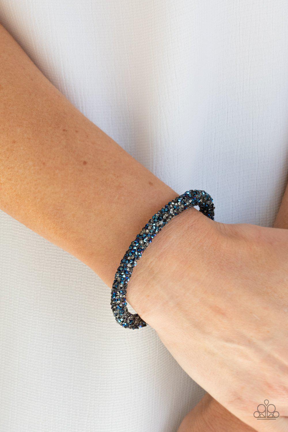 Roll Out The Glitz Multi Metallic Blue and Smoky Rhinestone Coil Bracelet - Paparazzi Accessories- on model - CarasShop.com - Paparazzi Jewelry by Cara Jewels