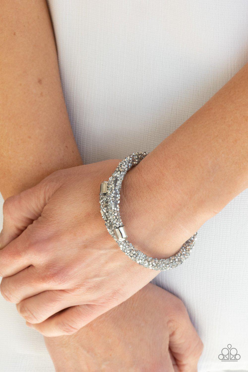 Roll Out The Glitz Silver and White Rhinestone Coil Bracelet - Paparazzi Accessories- on model - CarasShop.com - Paparazzi Jewelry by Cara Jewels
