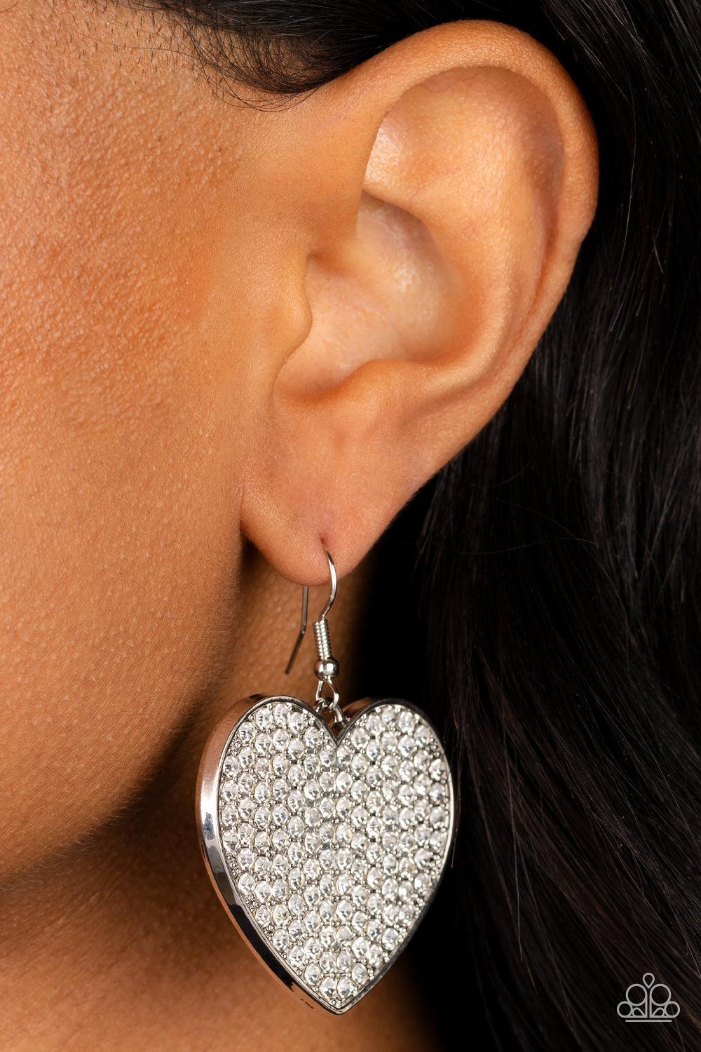 Romantic Reign White Rhinestone Heart Earrings - Paparazzi Accessories- on model - CarasShop.com - Paparazzi Jewelry by Cara Jewels