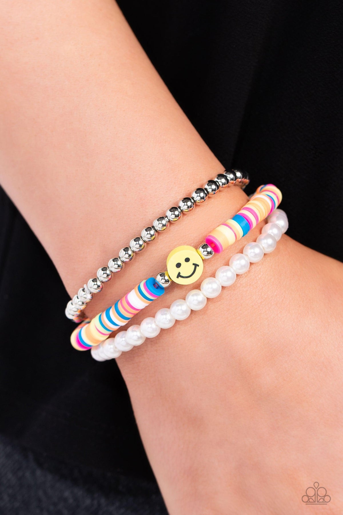 Run a SMILE Multi Happy Face Bracelet - Paparazzi Accessories- on model - CarasShop.com - Paparazzi Jewelry by Cara Jewels