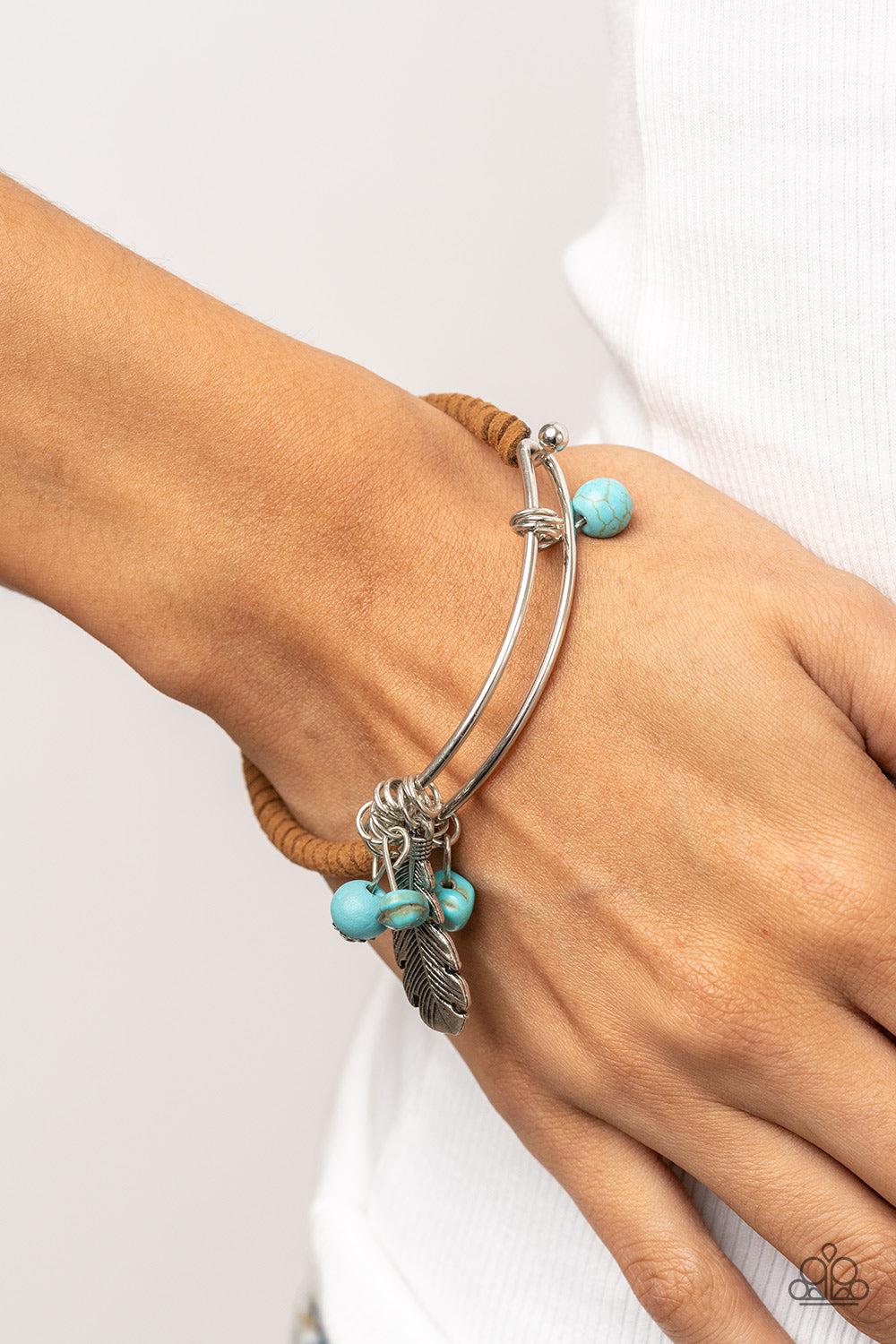 Running a-FOWL Blue and Brown Suede Bangle Bracelet - Paparazzi Accessories- on model - CarasShop.com - Paparazzi Jewelry by Cara Jewels
