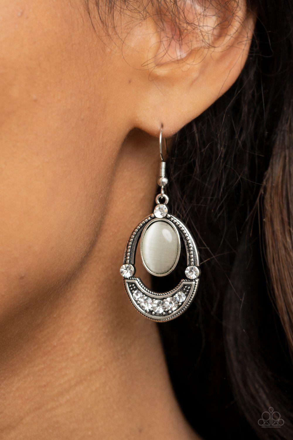 Serene Shimmer White Cat's Eye and Rhinestone Earrings - Paparazzi Accessories- on model - CarasShop.com - Paparazzi Jewelry by Cara Jewels