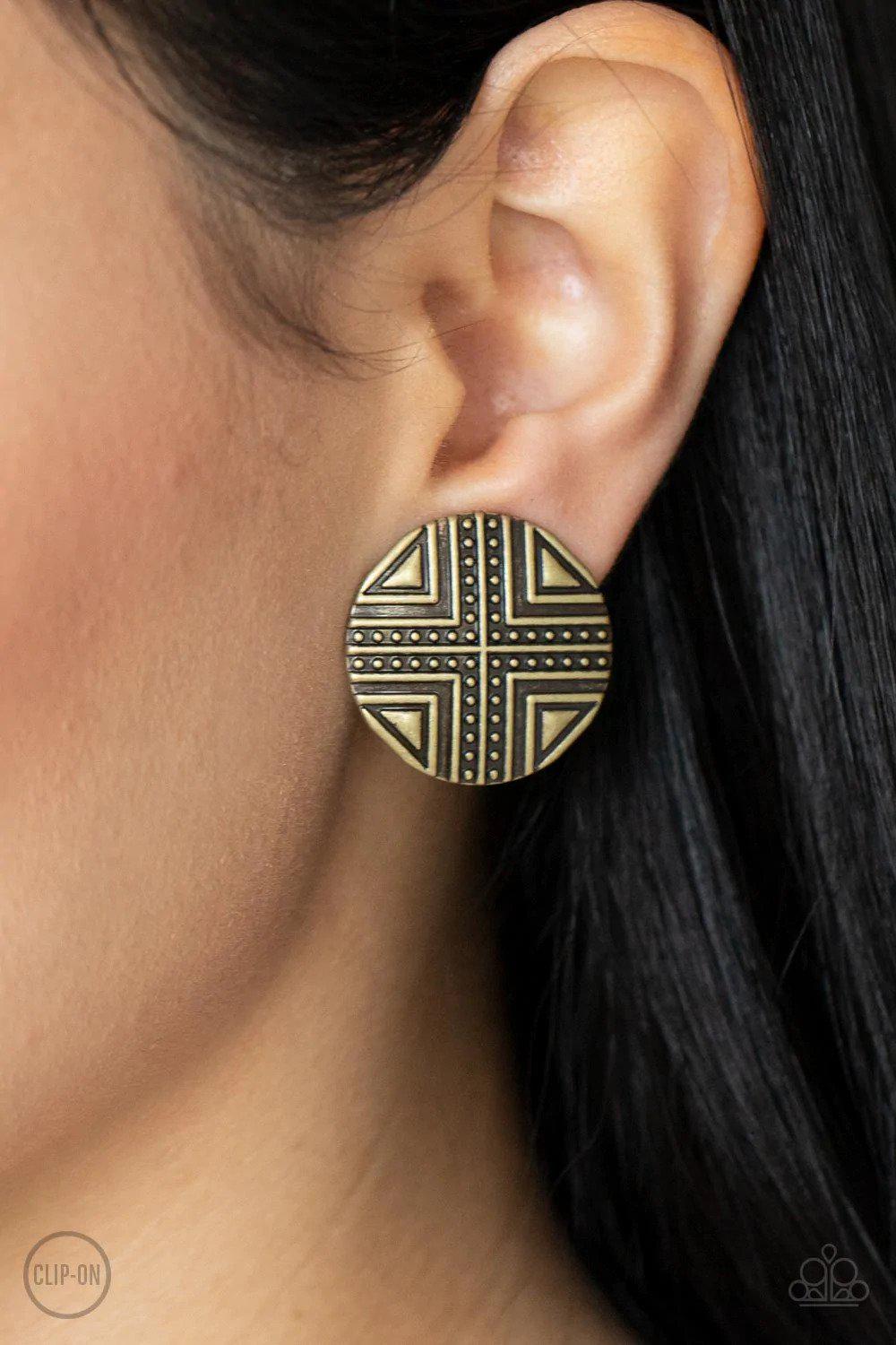 Shielded Shimmer Brass Clip On Earrings - Paparazzi Accessories- on model - CarasShop.com - Paparazzi Jewelry by Cara Jewels