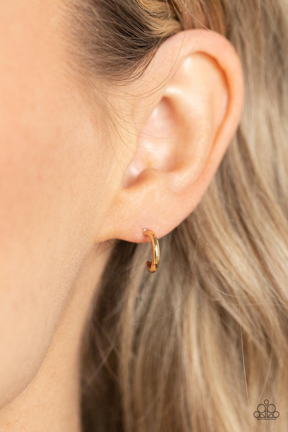 Skip the Small Talk Gold Hoop Earrings - Paparazzi Accessories- on model - CarasShop.com - Paparazzi Jewelry by Cara Jewels