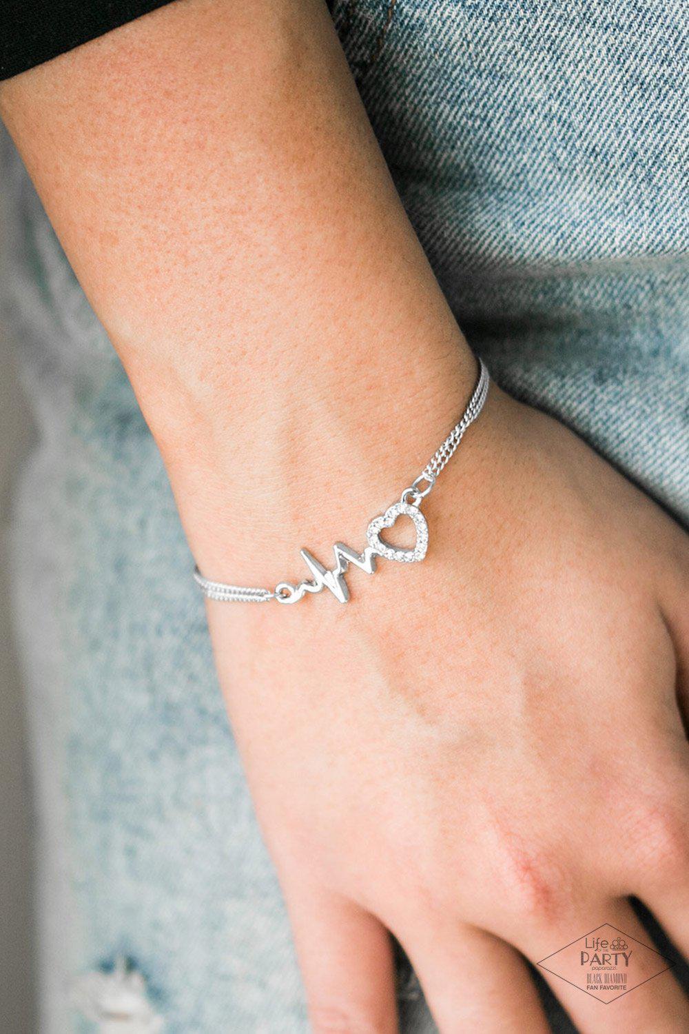 Skipping Beats White Rhinestone Heartbeat Bracelet - Paparazzi Accessories- lightbox - CarasShop.com - Paparazzi Jewelry by Cara Jewels