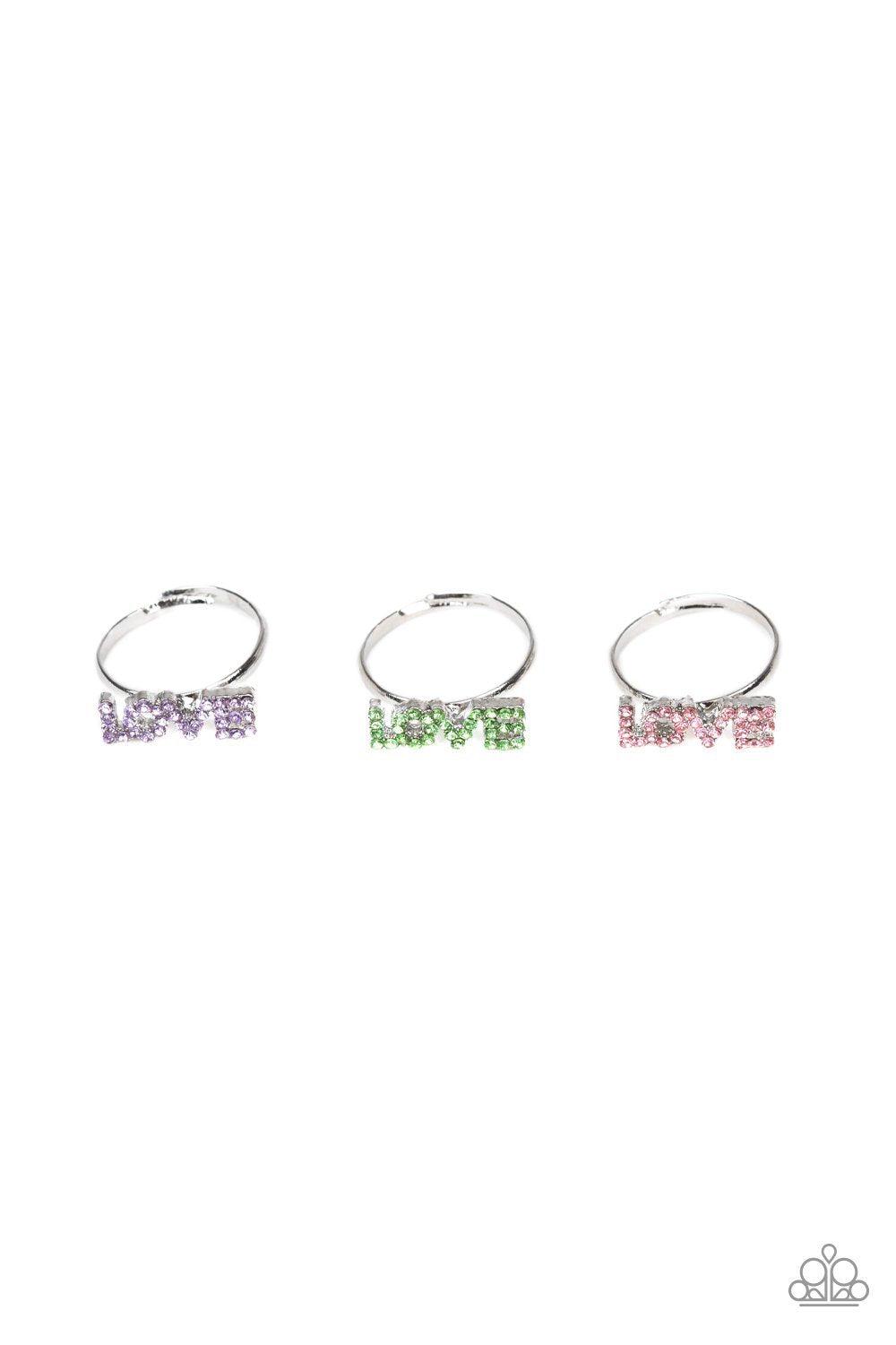 Starlet Shimmer Children's Rhinestone LOVE Rings - Paparazzi Accessories (set of 5)- on model - CarasShop.com - Paparazzi Jewelry by Cara Jewels