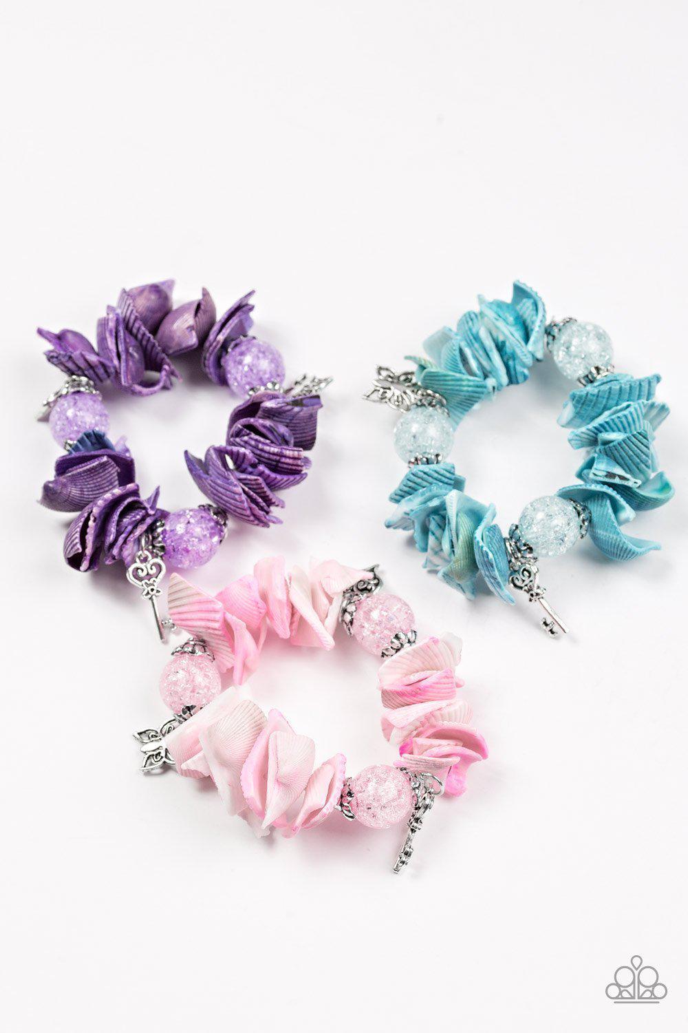 Starlet Shimmer Children's Shell Bracelets - Paparazzi Accessories (set of 5)- on model - CarasShop.com - Paparazzi Jewelry by Cara Jewels