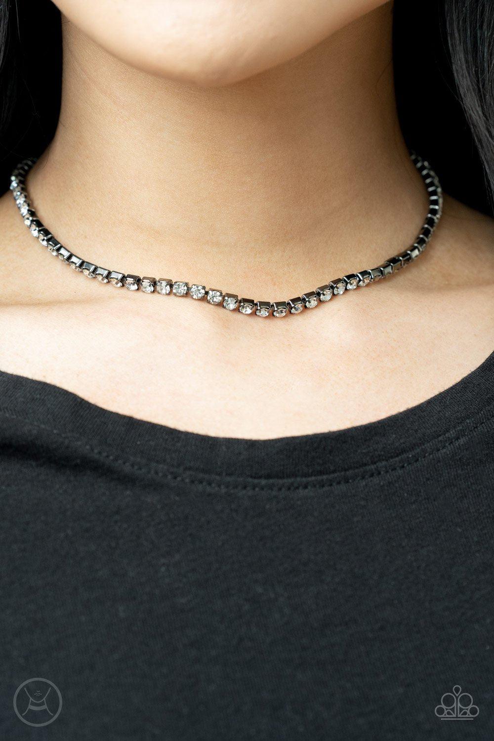 Starlight Radiance Gunmetal Black and White Rhinestone Choker Necklace - Paparazzi Accessories- on model - CarasShop.com - Paparazzi Jewelry by Cara Jewels