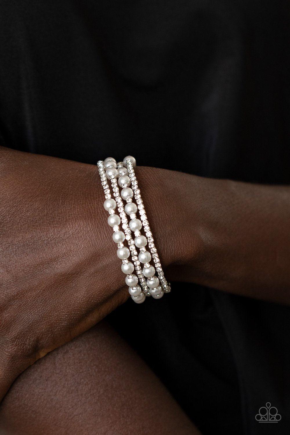 Starry Strut White Pearl and Rhinestone Infinity Wrap Bracelet - Paparazzi Accessories- on model - CarasShop.com - Paparazzi Jewelry by Cara Jewels