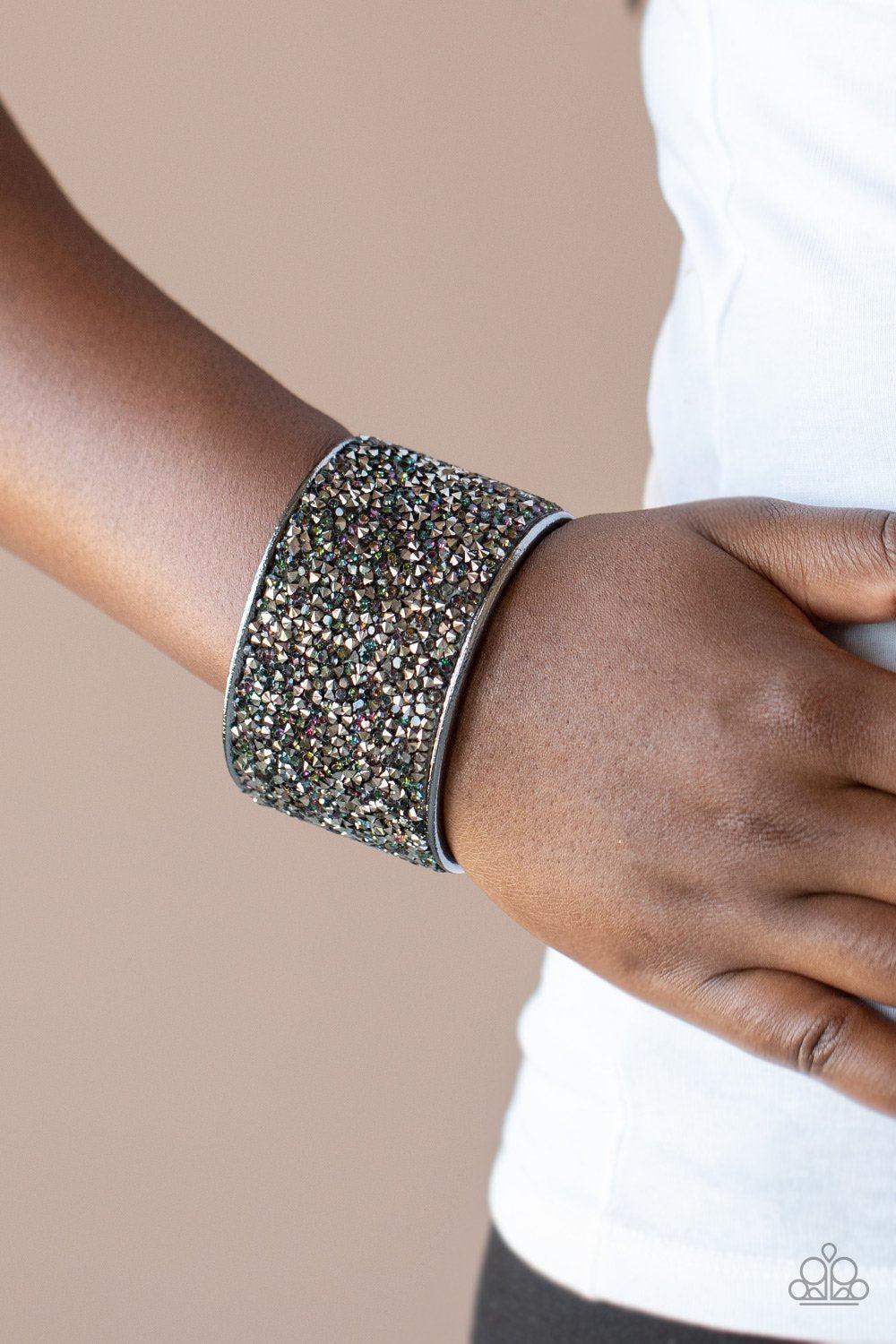 Stellar Radiance Multi Iridescent and Hematite Rhinestone Cuff Bracelet - Paparazzi Accessories- on model - CarasShop.com - Paparazzi Jewelry by Cara Jewels