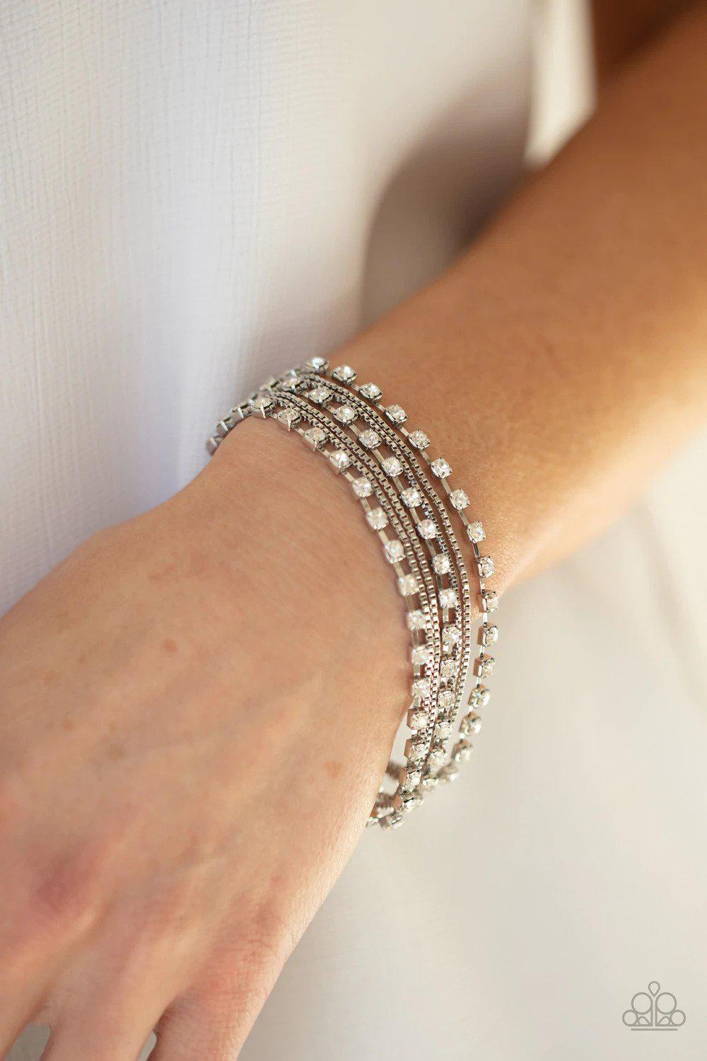 That's a Smash! White Rhinestone & Silver Chain Bracelet - Paparazzi Accessories- on model - CarasShop.com - Paparazzi Jewelry by Cara Jewels