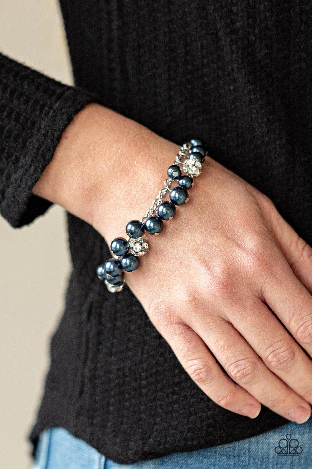The GRANDEUR Tour Blue and Silver Bracelet - Paparazzi Accessories- on model - CarasShop.com - Paparazzi Jewelry by Cara Jewels