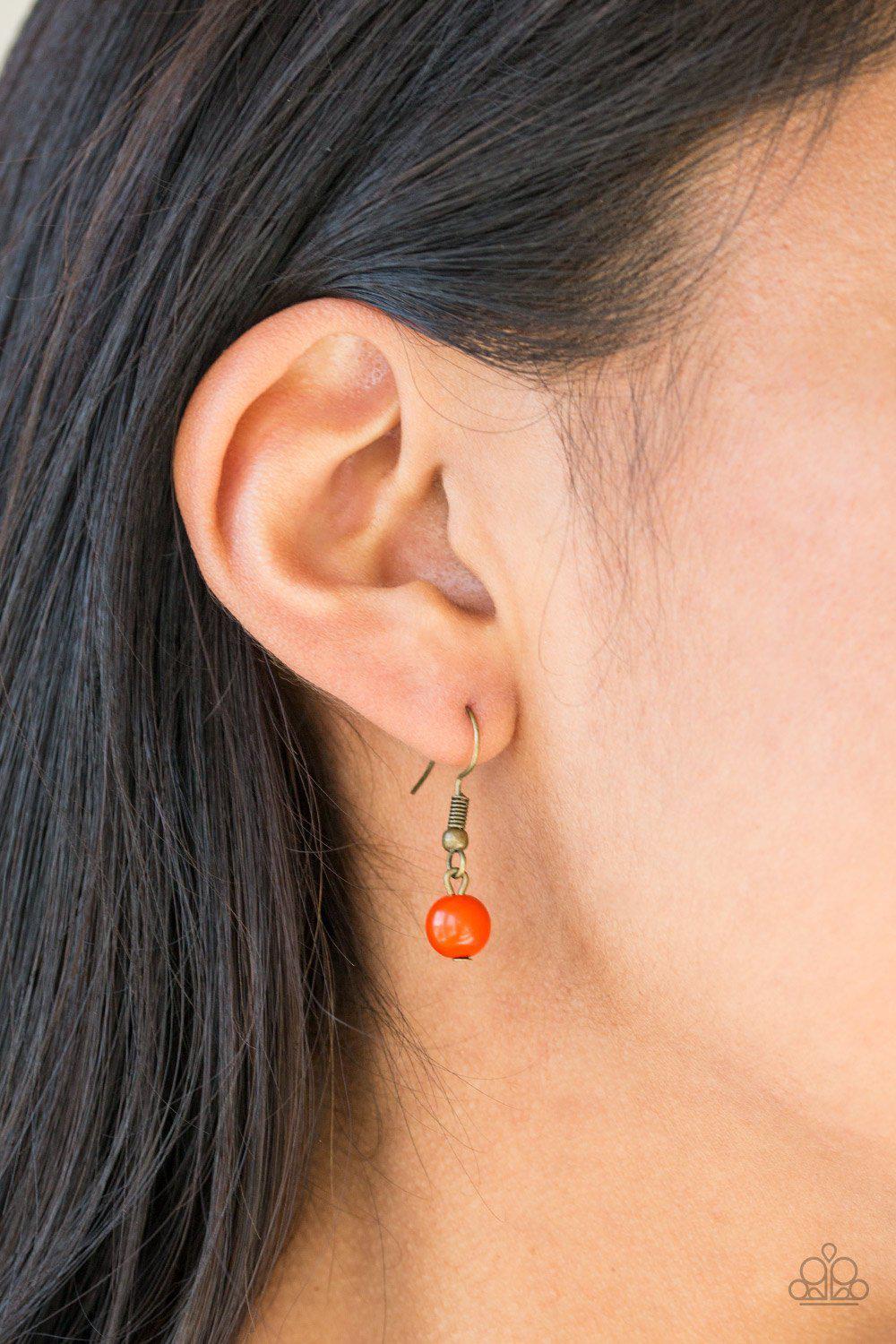 The GRIT Crowd Orange and Brass Necklace - Paparazzi Accessories- on model - CarasShop.com - Paparazzi Jewelry by Cara Jewels