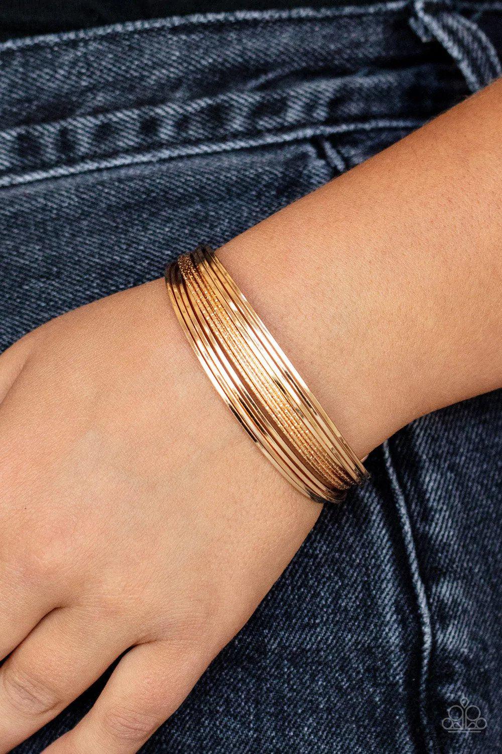 This Girl Is On WIRE Gold Bracelet - Paparazzi Accessories- on model - CarasShop.com - Paparazzi Jewelry by Cara Jewels