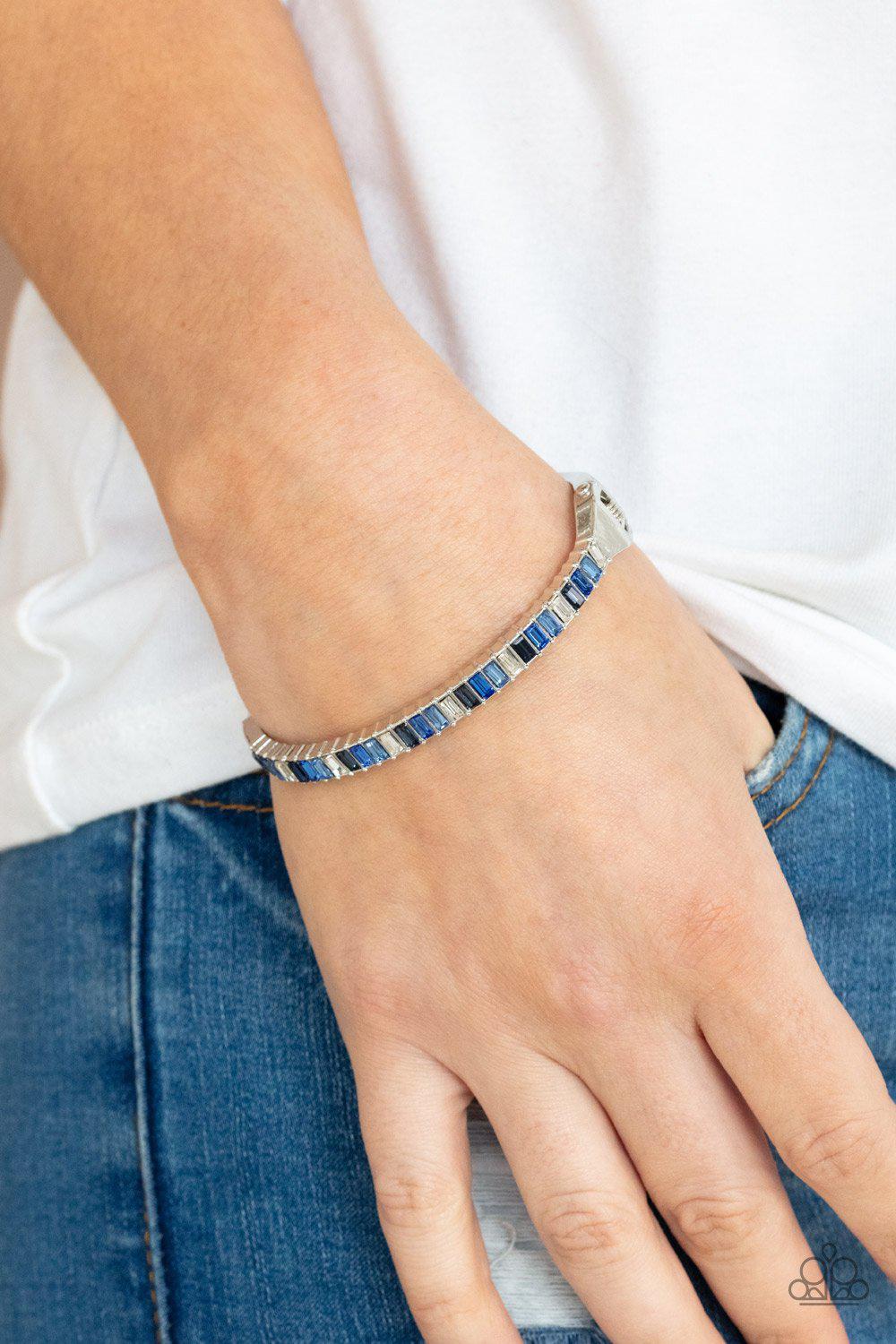 Toast to Twinkle Blue Rhinestone Hinged Bracelet - Paparazzi Accessories- on model - CarasShop.com - Paparazzi Jewelry by Cara Jewels